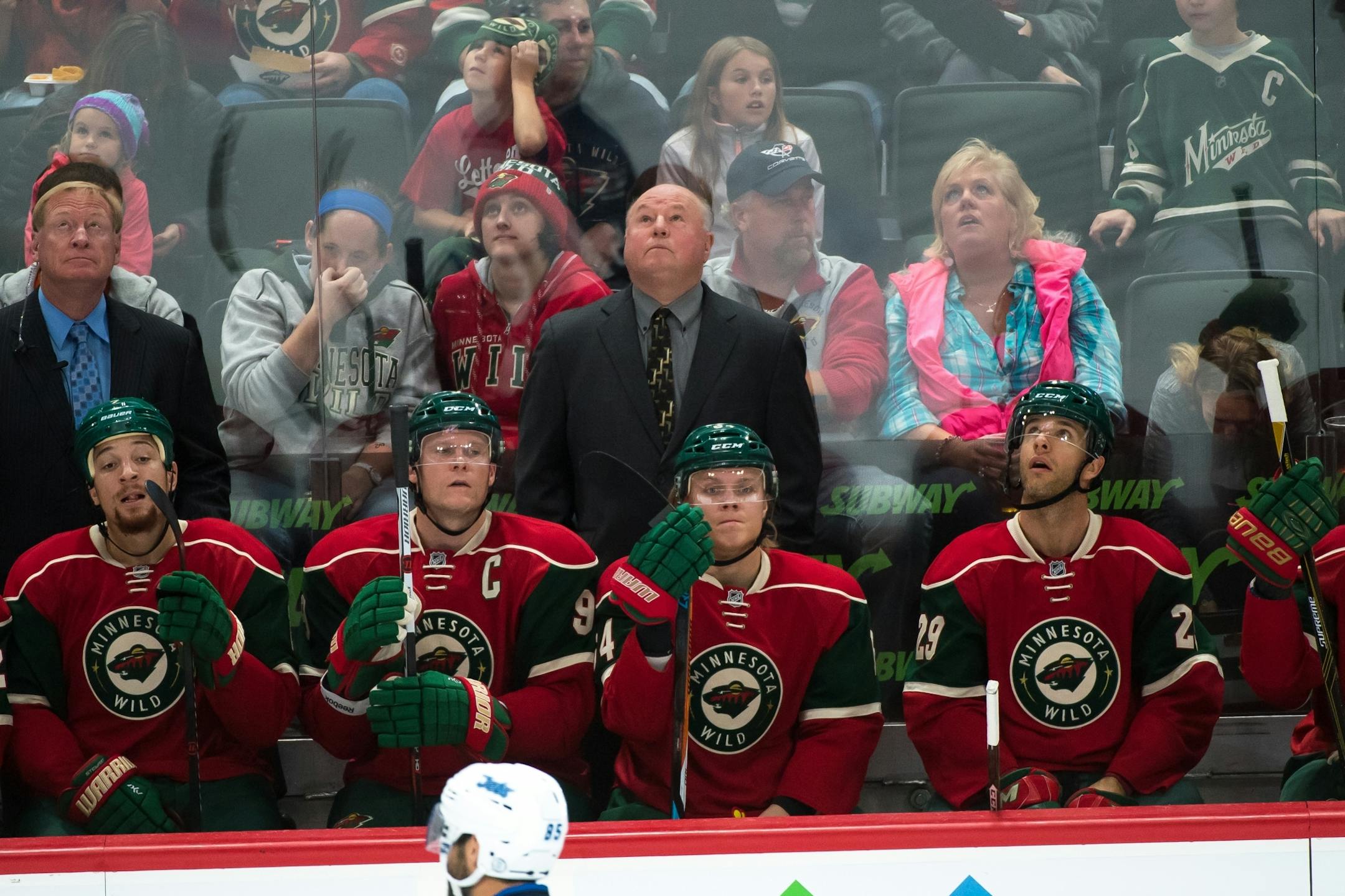 Wild Head Coach Bruce Boudreau watched the replay after a goal scored by Winnipeg Jets right wing Joel Armia (40) in the first period.