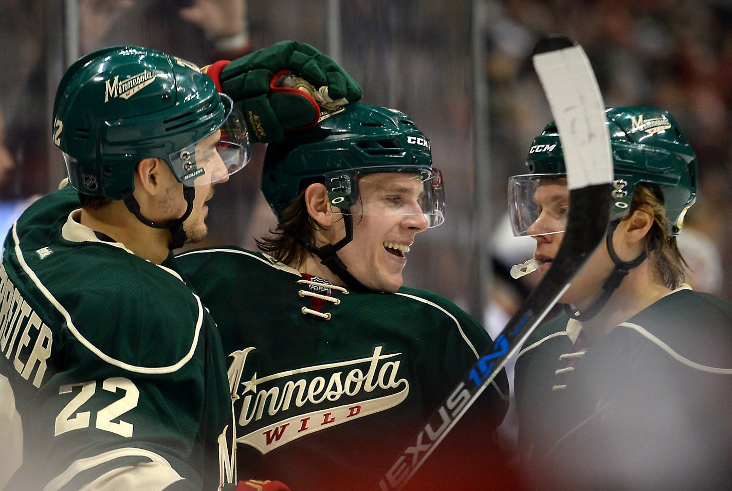 From left, Minnesota Wild right wing Nino Niederreiter (22), left wing Erik Haula (56) and center Mikael Granlund (64) celebrated an empty netter by Niederreiter in the third period against Chicago on Tuesday.