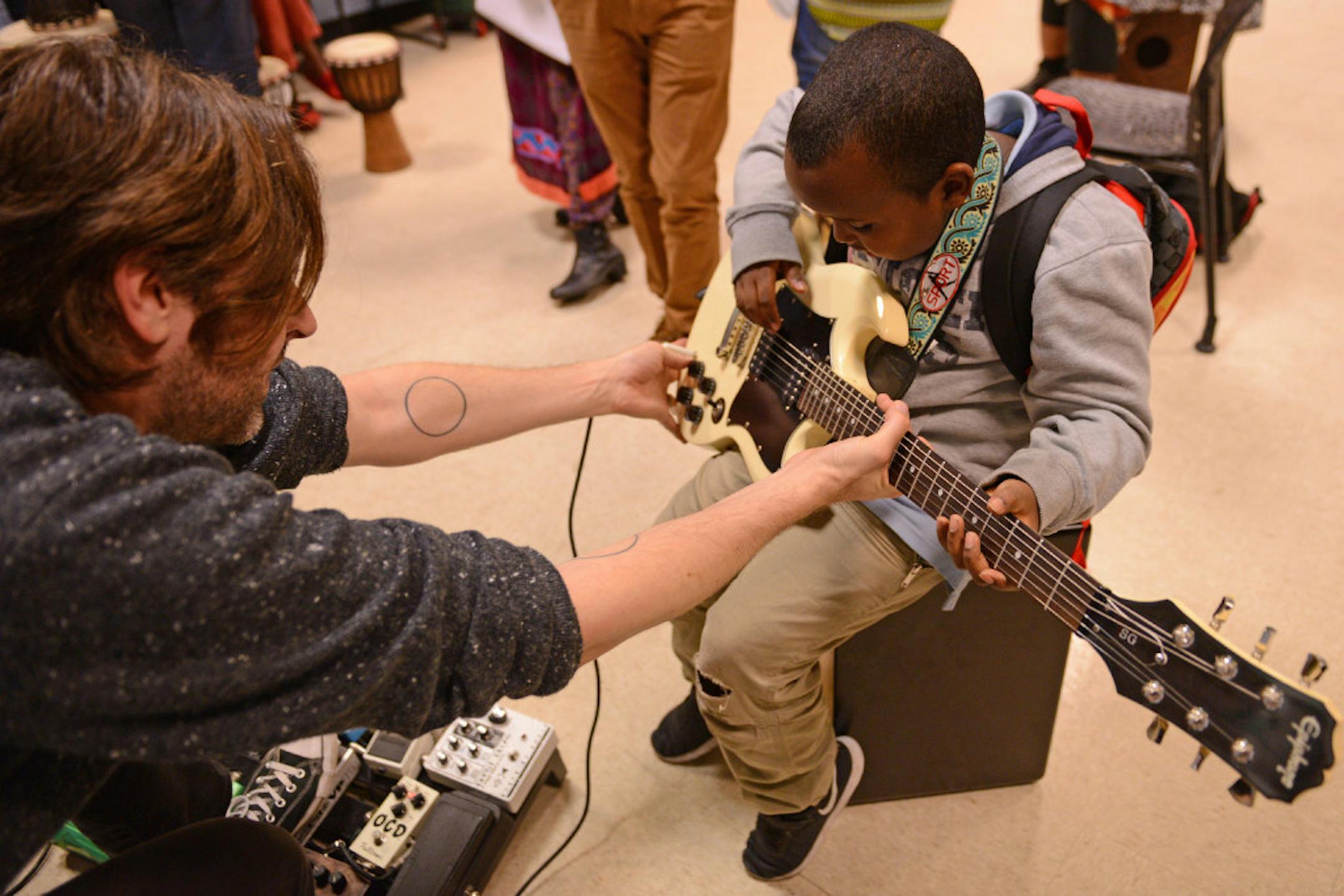Jeremy Ylvisaker in action teaching before the quarantine, shown here with 8-year-old Samir Muse at the Brian Cole Center.