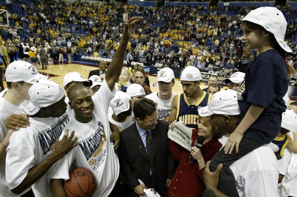 March 29, 2003: Dwyane Wade (arm up) took a quantum leap at the Metrodome during the Midwest Regional while with Marquette.