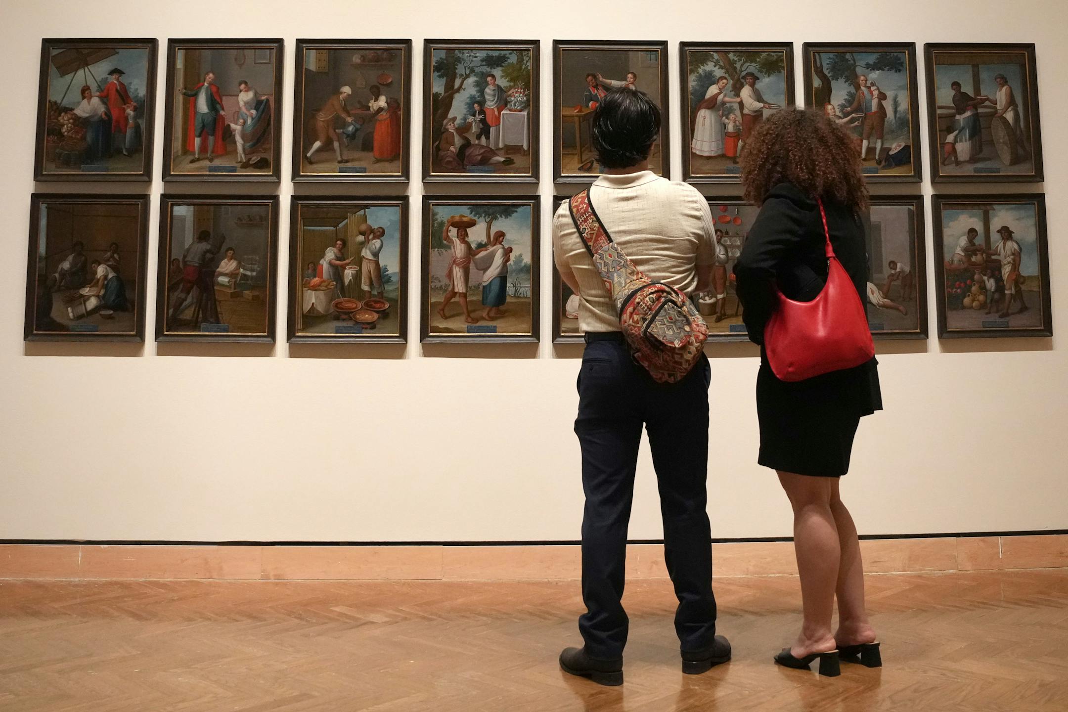 People stop to view the set of Casta paintings by Francisco Clapera as it hangs in the new ReVisión: Art in the Americas exhibit during a press preview Thursday, June 29, 2023 at the Minneapolis Institute of Art in Minneapolis. ] ANTHONY SOUFFLE • anthony.souffle@startribune.com