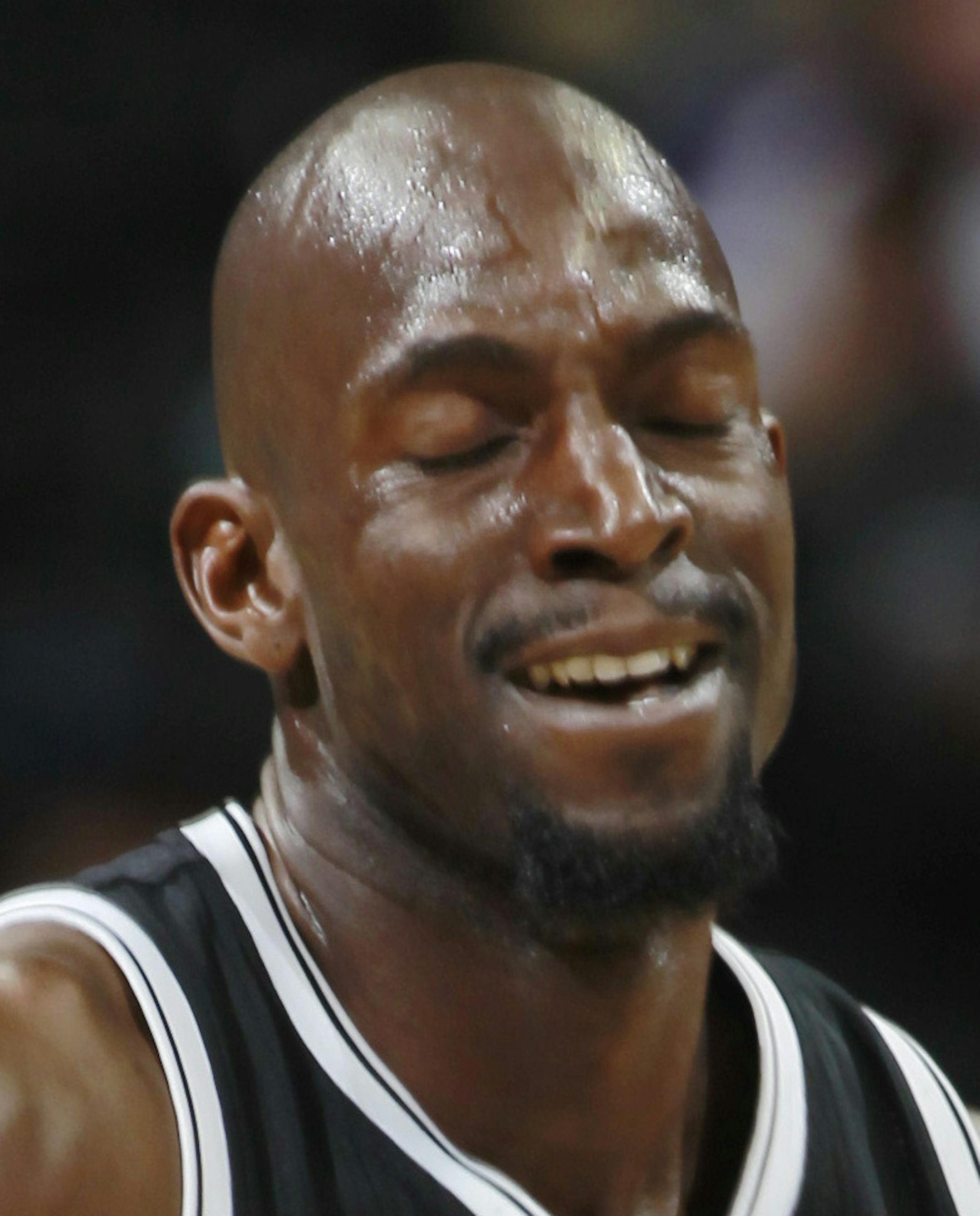 Brooklyn Nets forward Kevin Garnett runs court against the Denver Nuggets in the third quarter of the Nets' 112-89 victory in an NBA basketball game in Denver on Thursday, Feb. 27, 2014. (AP Photo/David Zalubowski)