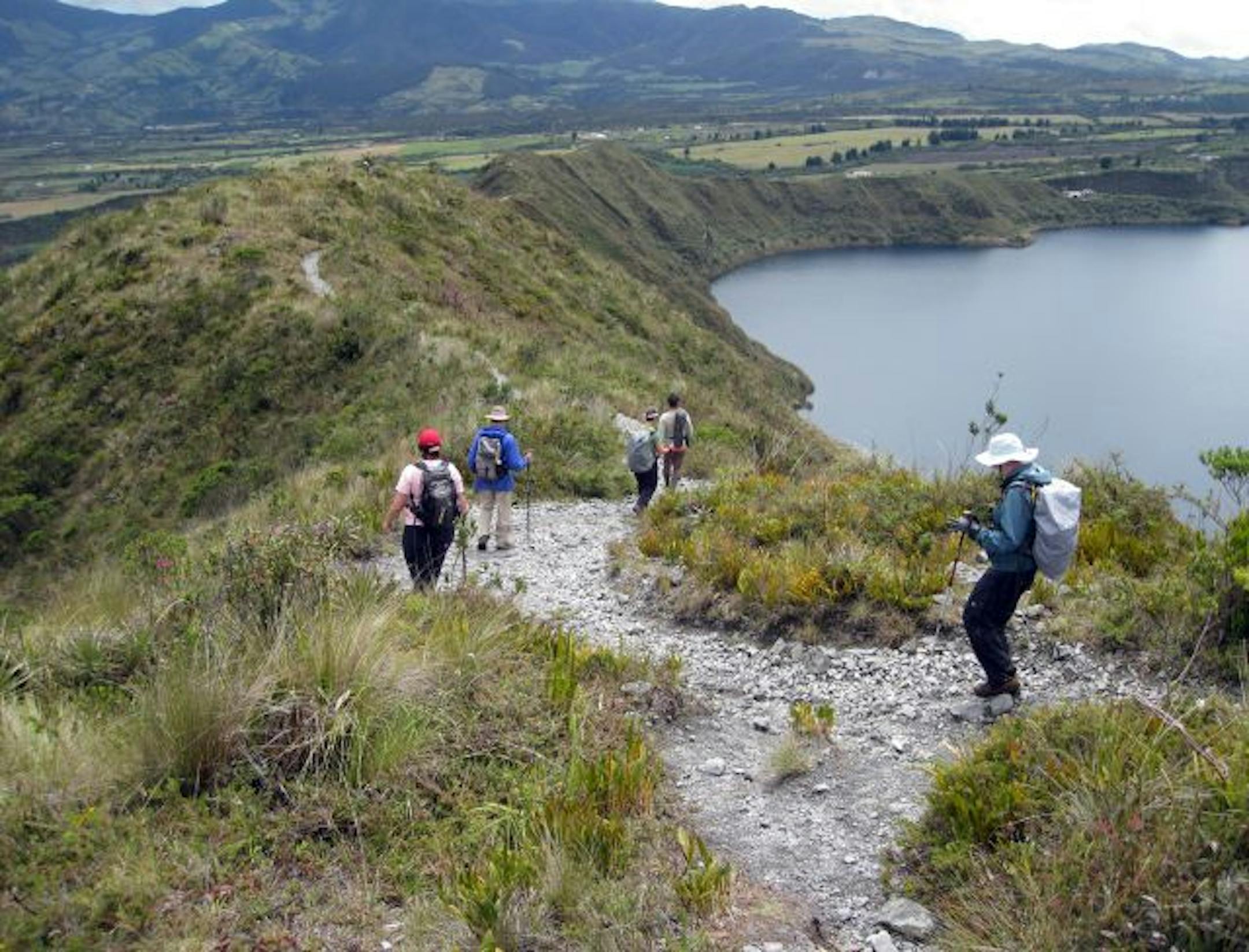 Hikers navigate the six-mile trail rimming the Laguna de Cuicocha, a lake formed in a volcanic crater in the Ecuadoran Highlands.