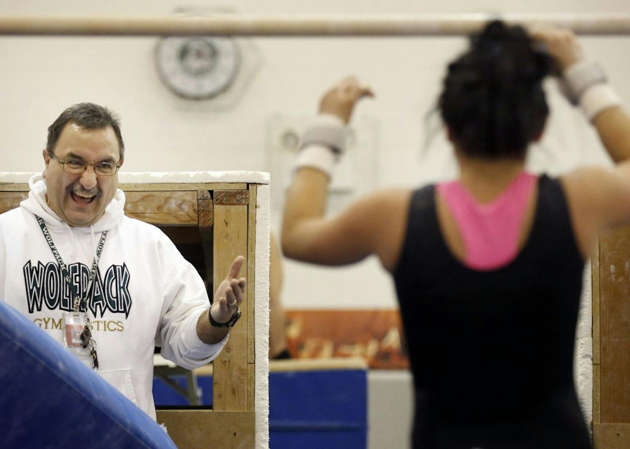 Park of Cottage Grove coach Mark Sikich worked with Morgan Schank during practice on Tuesday. Sikich is a member of the Minnesota Girls Gymnastics Coaches Association Hall of Fame. Photo by CARLOS GONZALEZ • cgonzalez@startribune.com