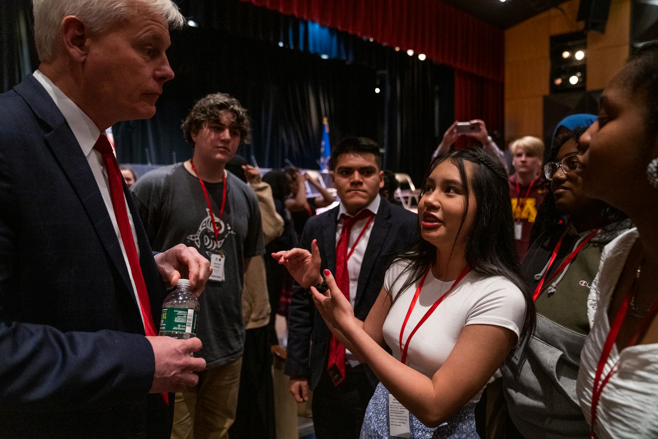 Paola Hernandez Zuniga, a junior at Richfield High School, asks questions of Associate Justice Paul C. Thissen