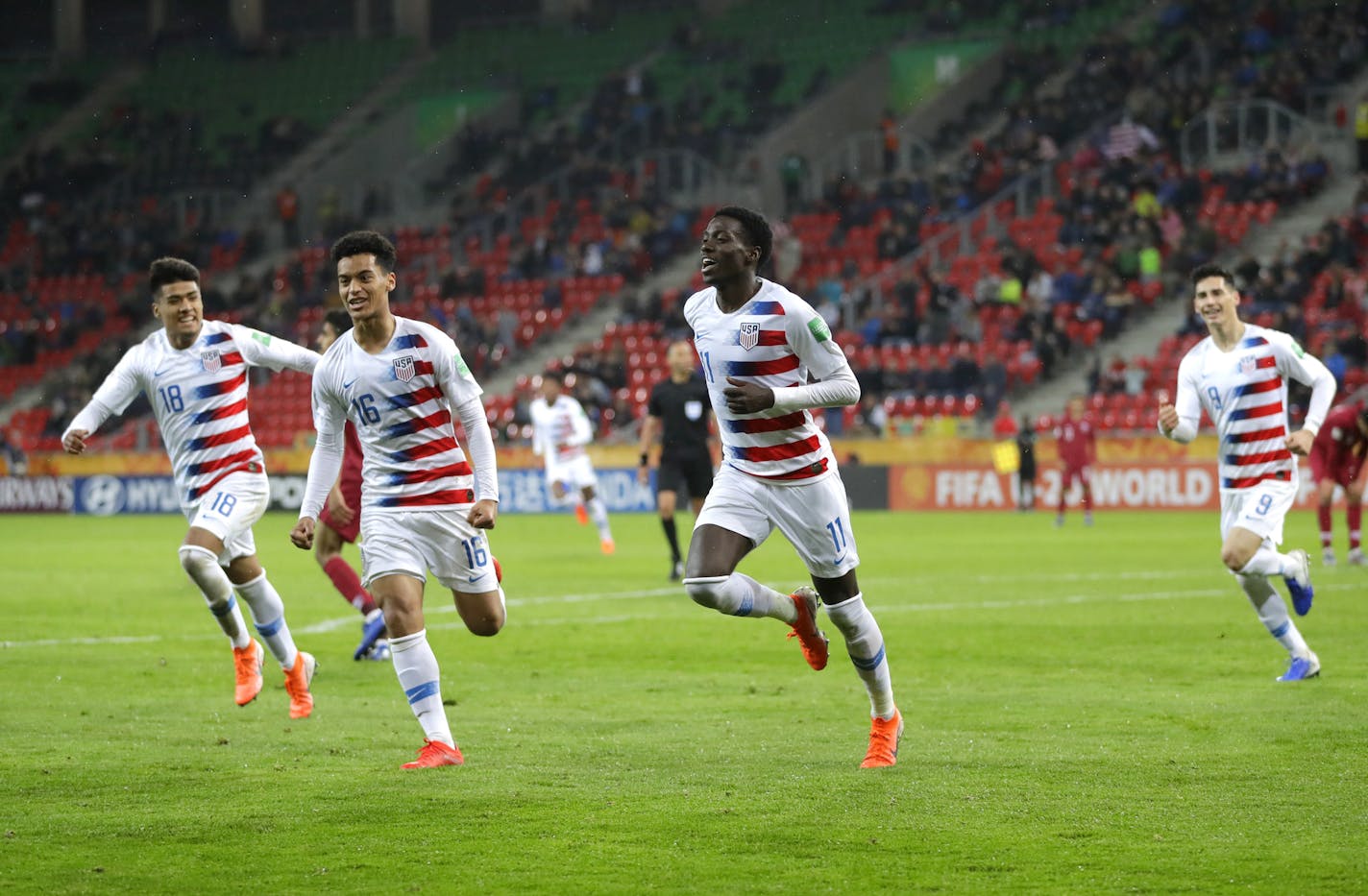 The United States' Tim Weah, second right, celebrates with teammates after scoring his side's opening goal during the Group D U-20 World Cup soccer match between USA and Qatar on May 30 in Tychy, Poland.