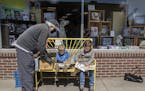 Bill Friedrich looked through books with his grandsons Will, 2, center, and Sully, 5, at Excelsior Bay Books, Monday, May 11, 2020 in Excelsior, MN. W