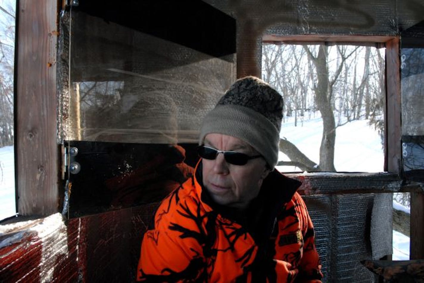 Ron Schultz is an enclosed deer stand, overlooking 160 acres he keeps primarily for archery hunting. He is killing some deer on his property as part of the DNR's testing of southeastern Minnesota whitetails for chronic wasting disease, or CWD.