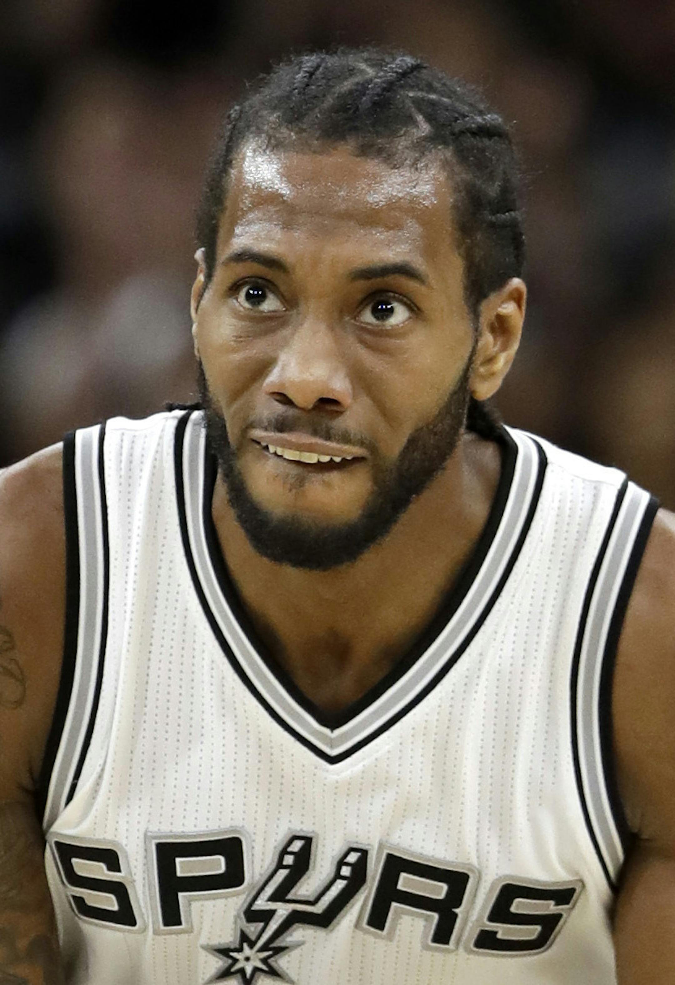 San Antonio Spurs forward Kawhi Leonard (2) reacts to a score against the Utah Jazz as he runs up court during the first half of an NBA basketball game, Tuesday, Nov. 1, 2016, in San Antonio. Utah won 106-91. (AP Photo/Eric Gay) ORG XMIT: TXEG101