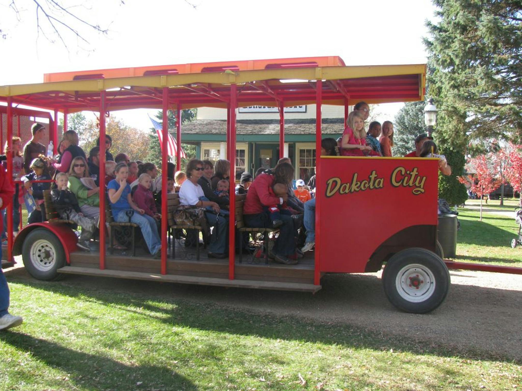 Courtesy of Dakota City Heritage Village. Attendees of last year�s Harvest Moon Festival rode a trolley to a cornfield, where they picked corn to be shelled and grinded.