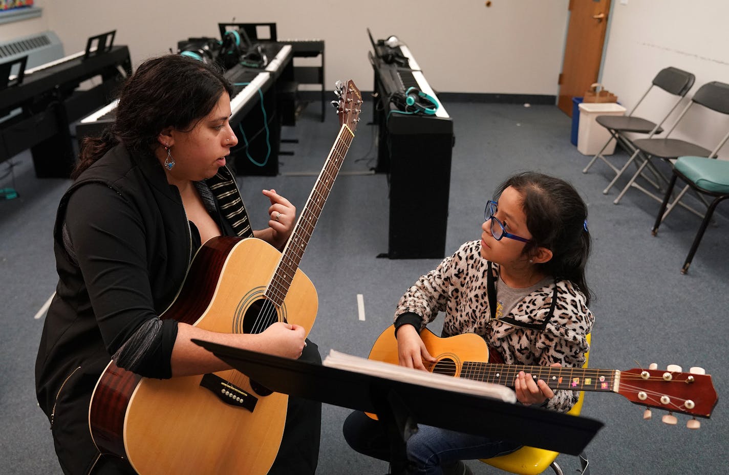 Instructor Wendy Johnson worked with Erika Estrada, 9, during her guitar lesson Wednesday evening at Hopewell Music. ] ANTHONY SOUFFLE &#x2022; anthony.souffle@startribune.com Instructors worked with students in one-on-one lessons Wednesday, Jan. 22, 2020 at Hopewell Music in North Minneapolis. Hopewell recently faced a financial crisis and facing possible closure, but was able to raise over $50,000 through donations on its website.