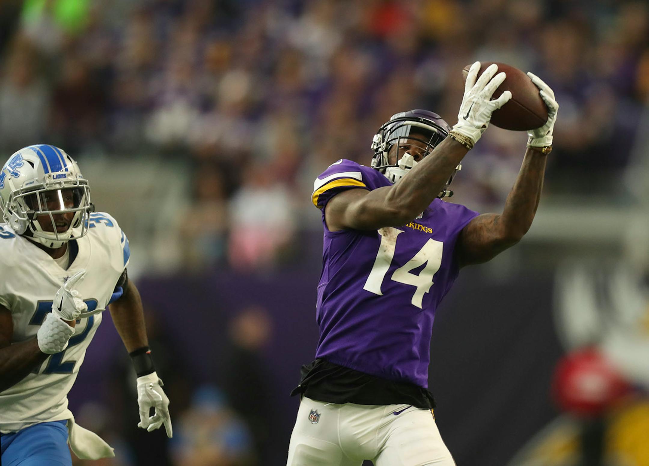 Minnesota Vikings wide receiver Stefon Diggs made a 32 yard pass reception while defended by Detroit Lions strong safety Tavon Wilson (32) in the third quarter.
