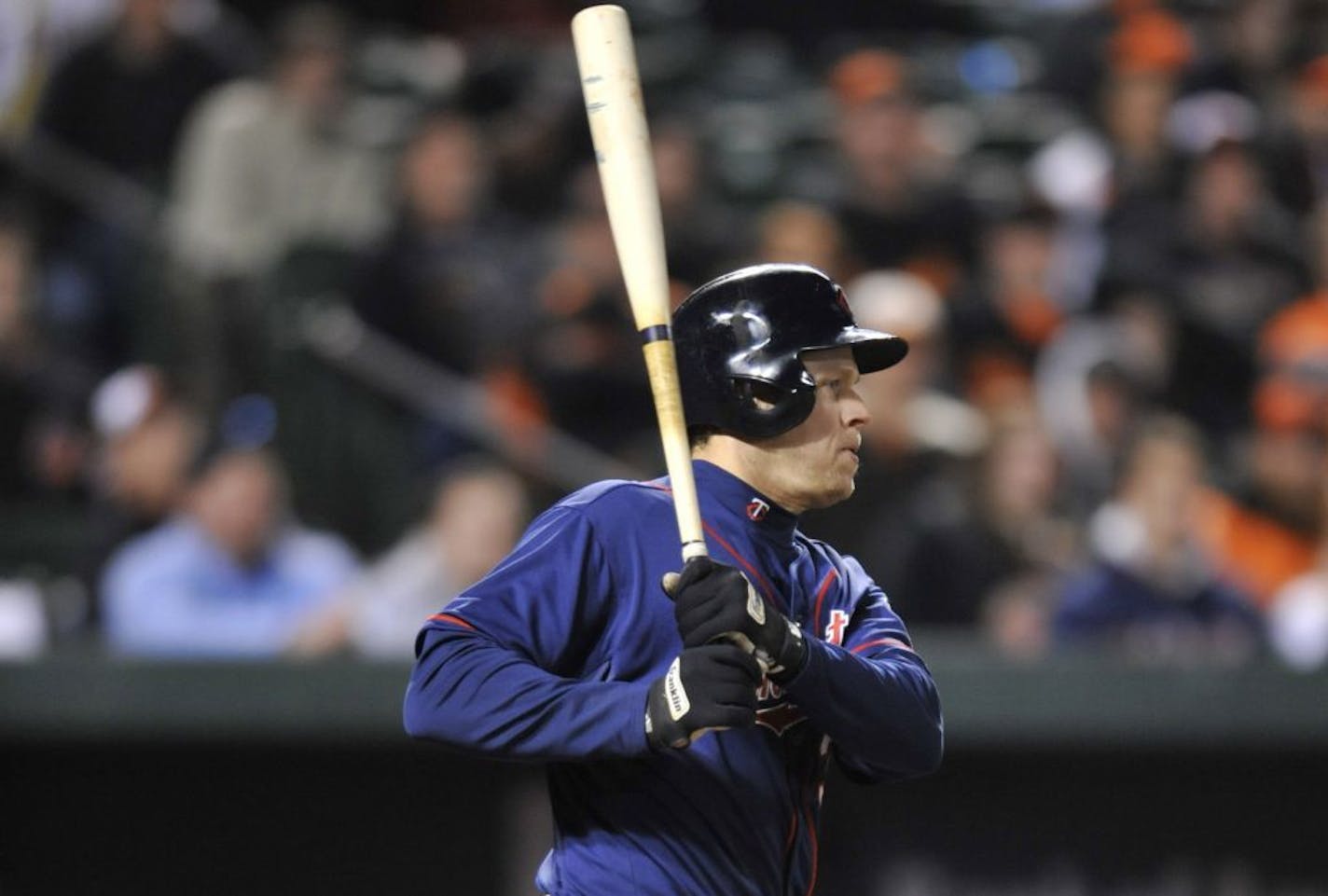 Justin Morneau follows through on an RBI single for the go-ahead run against the Orioles