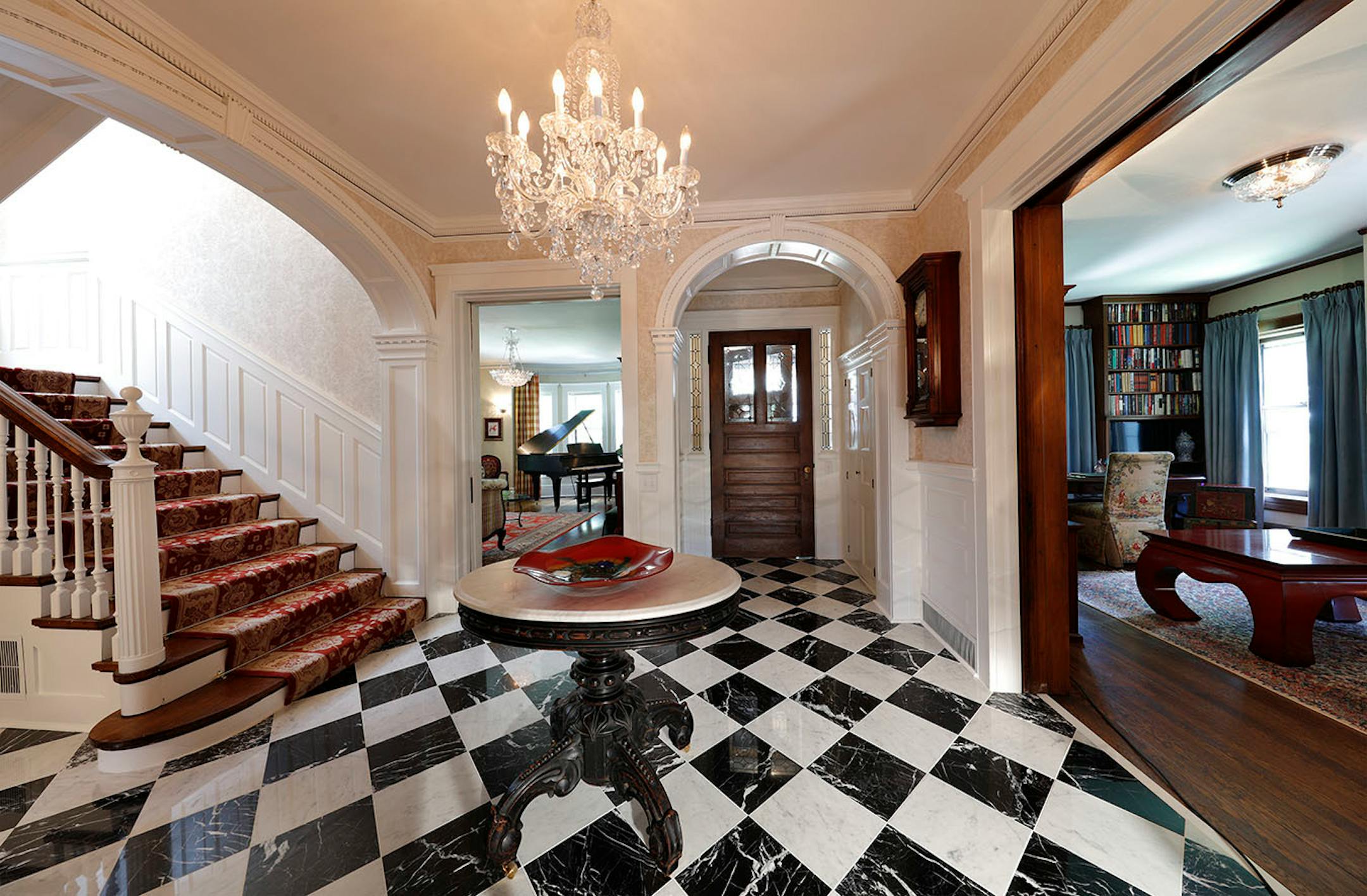 The grand entry features arches that frame views into other rooms.