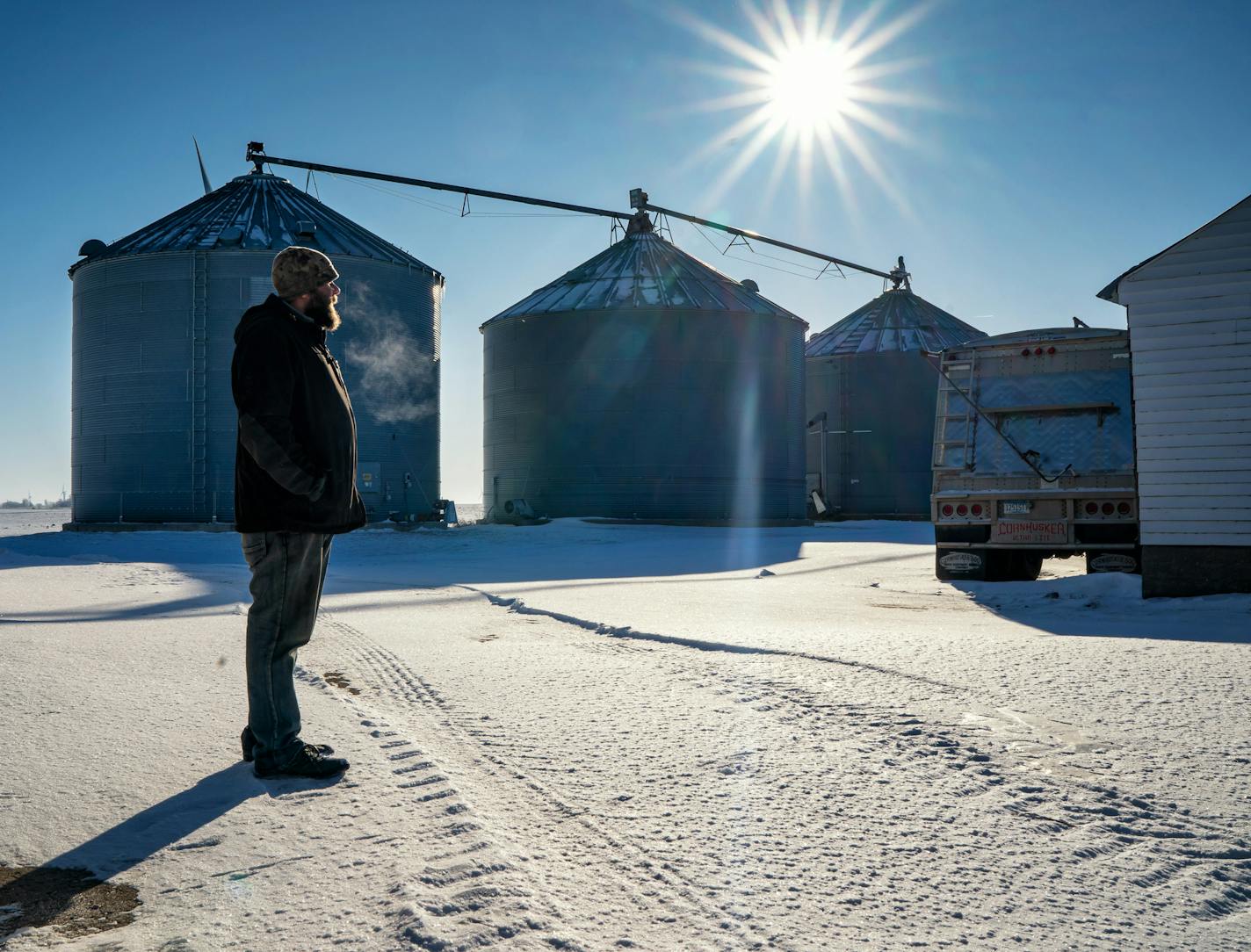 Lance Daberkow and his family have seen income from their farm in southwest Minnesota shrink over the past two years amid Trump's trade and fuel policies. "It's tight, especially with two kids," he says.