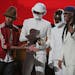 Pharrnell Williams, Daft Punk duo, and Nile Rogers on stage to accept the Grammy for Record of the Year at the 56th Annual Grammy Awards at Staples Ce