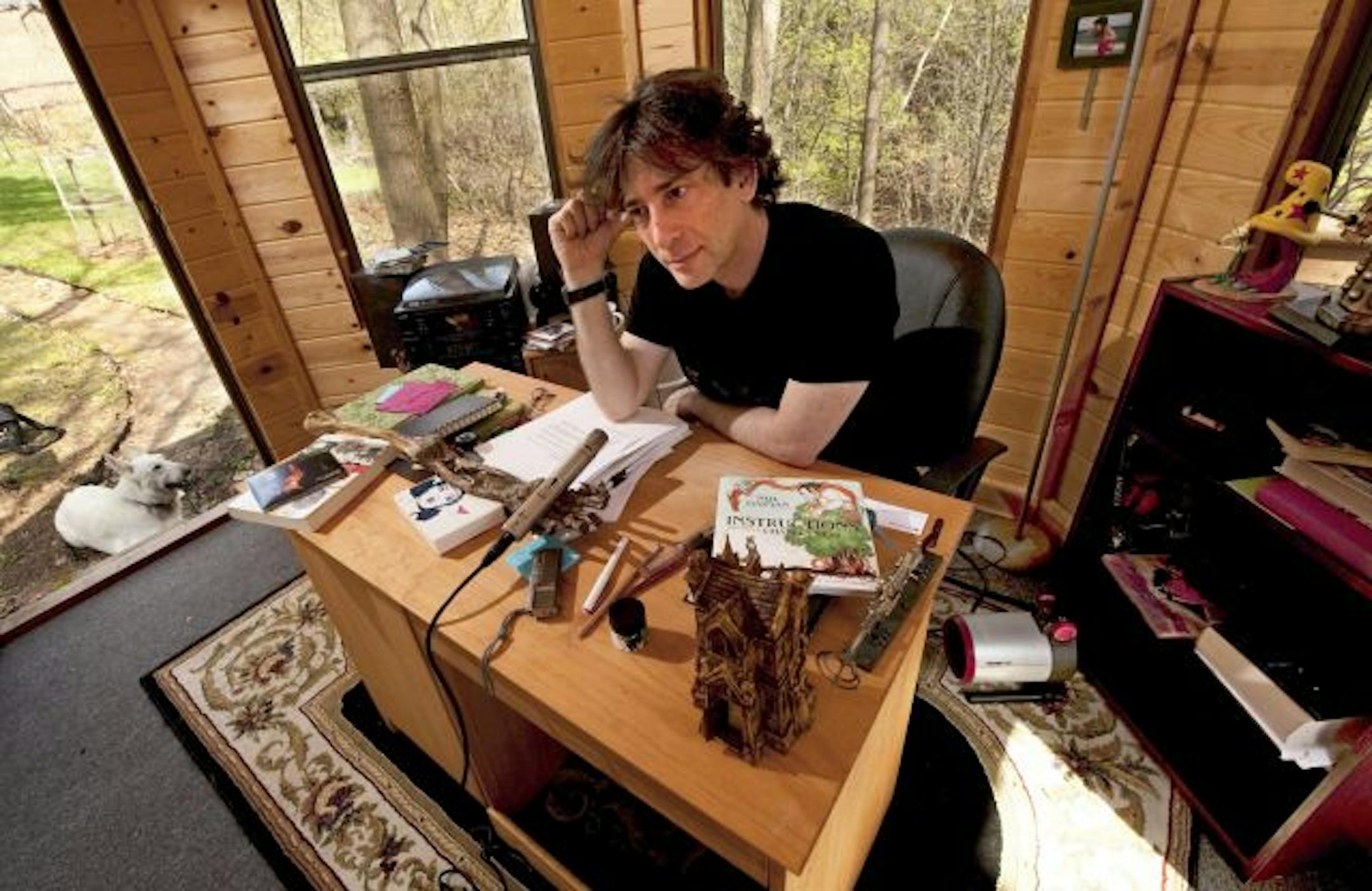 In this April 23, 2010 photo, best-selling author Neil Gaiman, 49, sits in his writing gazebo at his home in western Wisconsin.