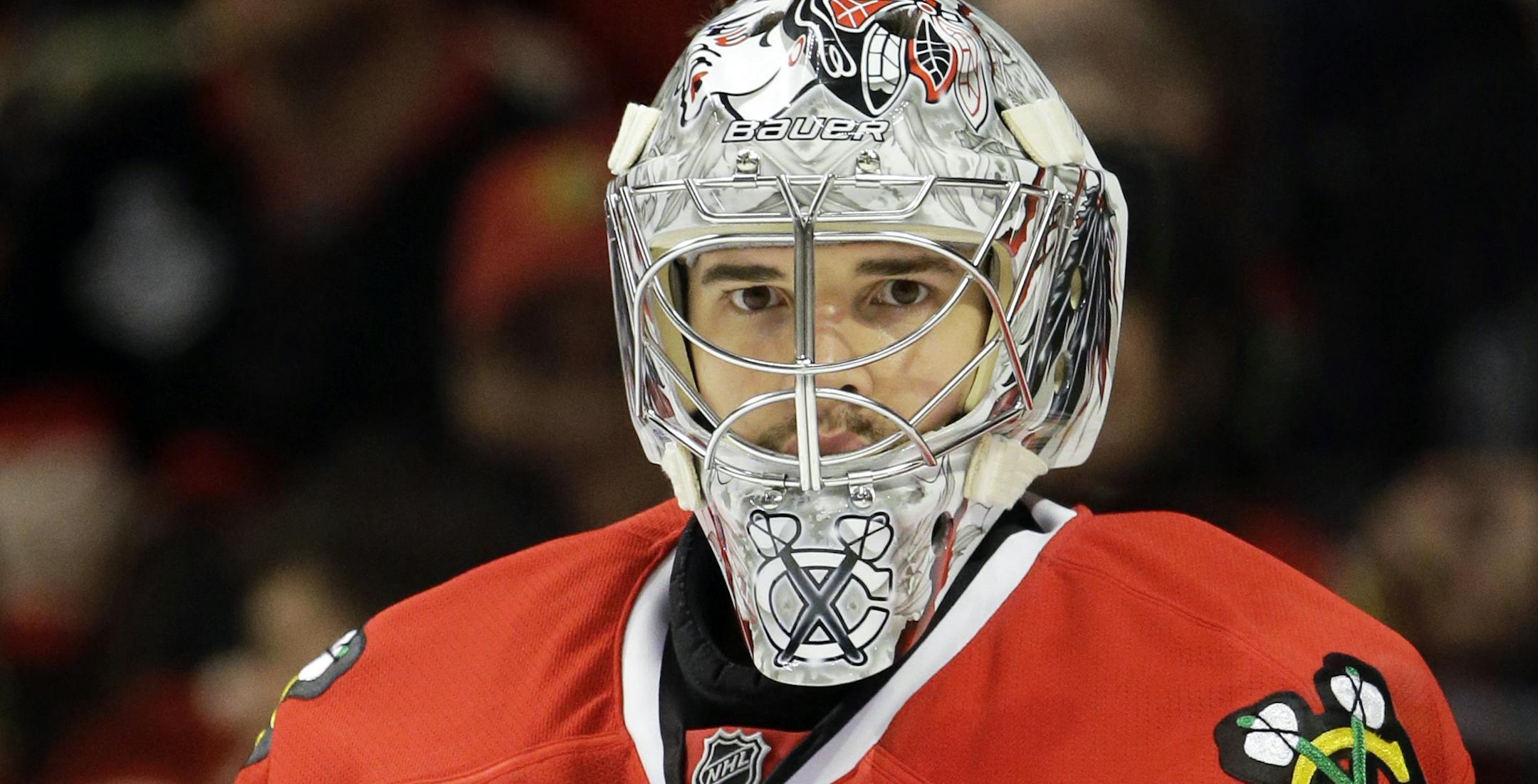Chicago Blackhawks goalie Corey Crawford looks around during the first period of Game 5 of an NHL hockey Stanley Cup first-round playoff series against the Minnesota Wild in Chicago, Thursday, May 9, 2013. (AP Photo/Nam Y. Huh) ORG XMIT: MIN2013050922435694