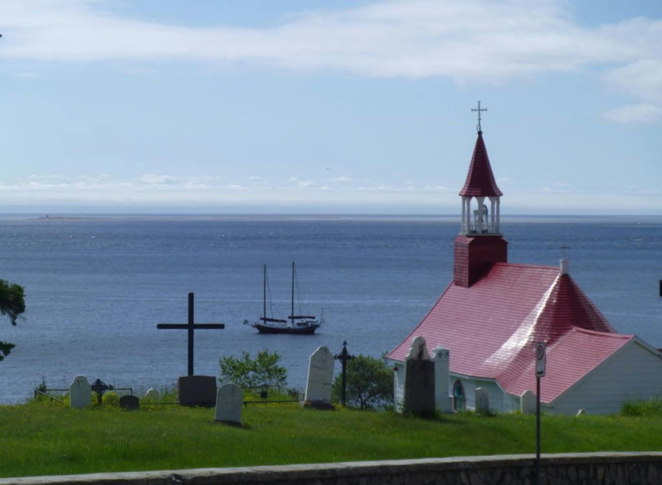 A chapel built in 1747 overlooks the harbor of Tadoussac, Quebec.