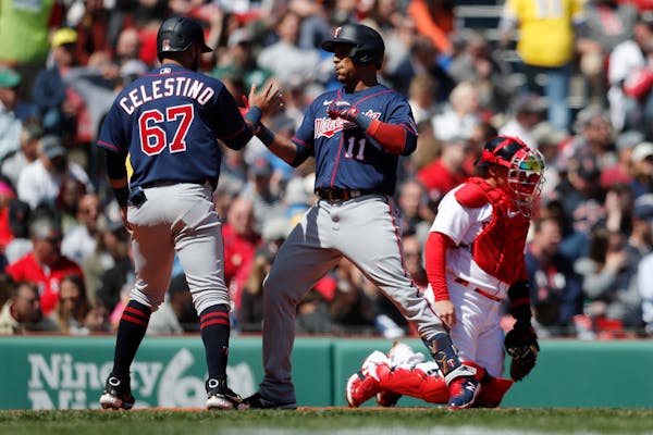 Jorge Polanco of the Twins celebrated his two-run homer with teammate Gilberto Celestino on Monday at Fenway Park.