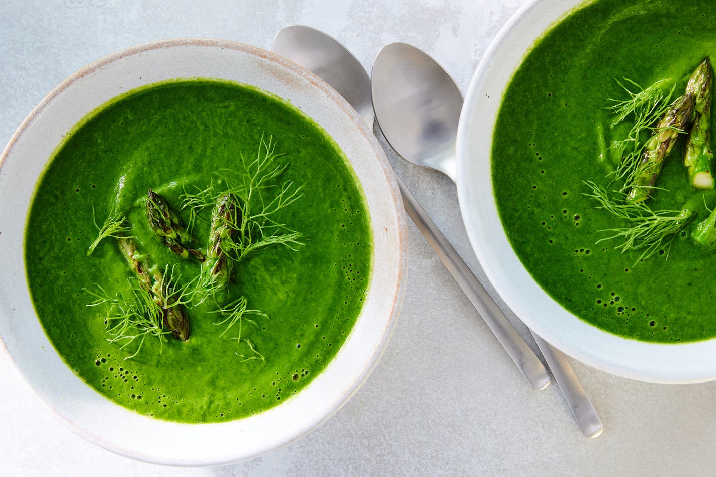 Asparagus-leek soup in New York, May 4, 2023. Spinach, zucchini, fennel and a brilliantly flavored mix of herbs back up asparagus in this verdant but easy soup. Food styled by Maggie Ruggiero. (Ryan Liebe/The New York Times)