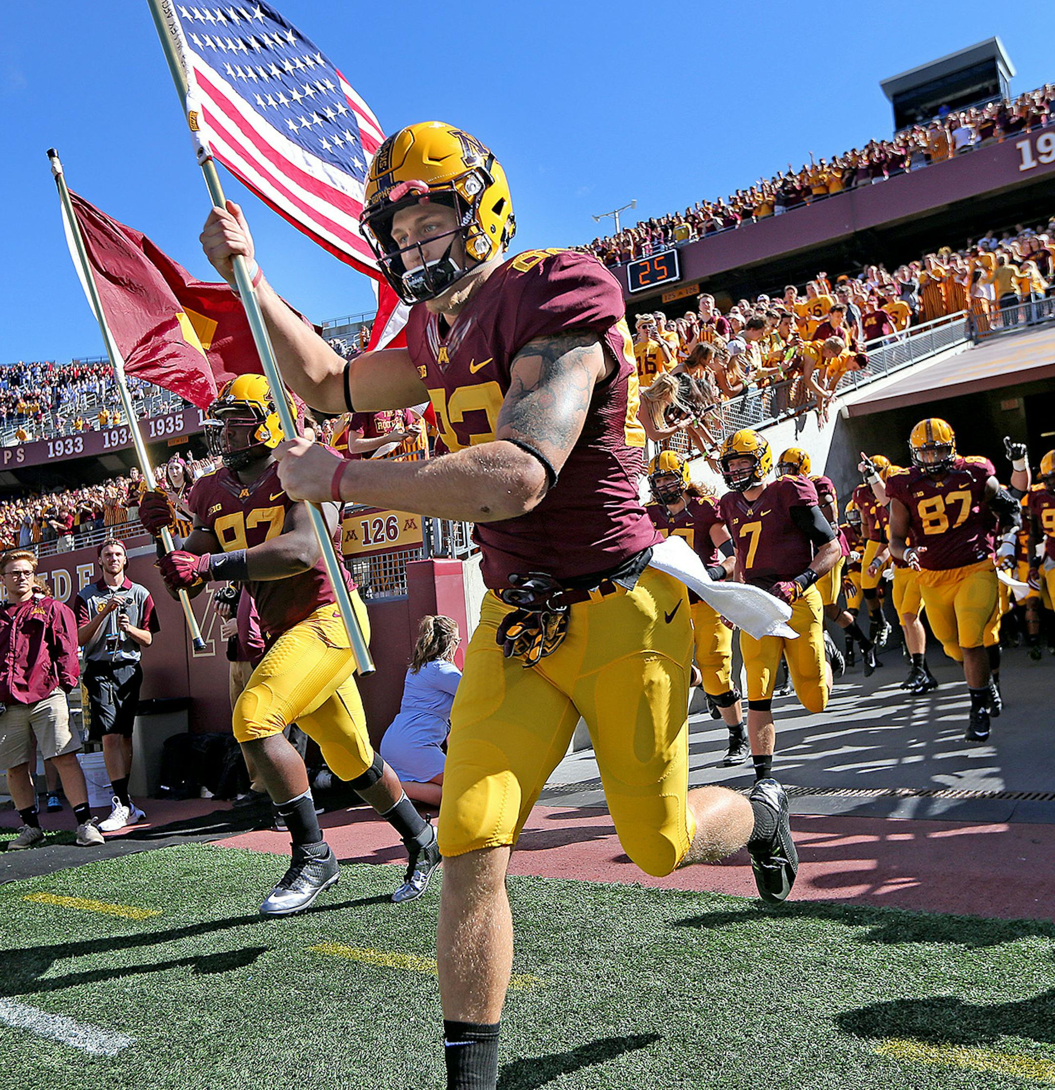 Minnesota Gophers wide receiver Drew Wolitarsky carried the American Flag and led the team onto the field before the Gophers took on Indiana State at TCF Bank Stadium, Saturday, September 10, 2016 in Minneapolis, MN. ] (ELIZABETH FLORES/STAR TRIBUNE) ELIZABETH FLORES • eflores@startribune.com