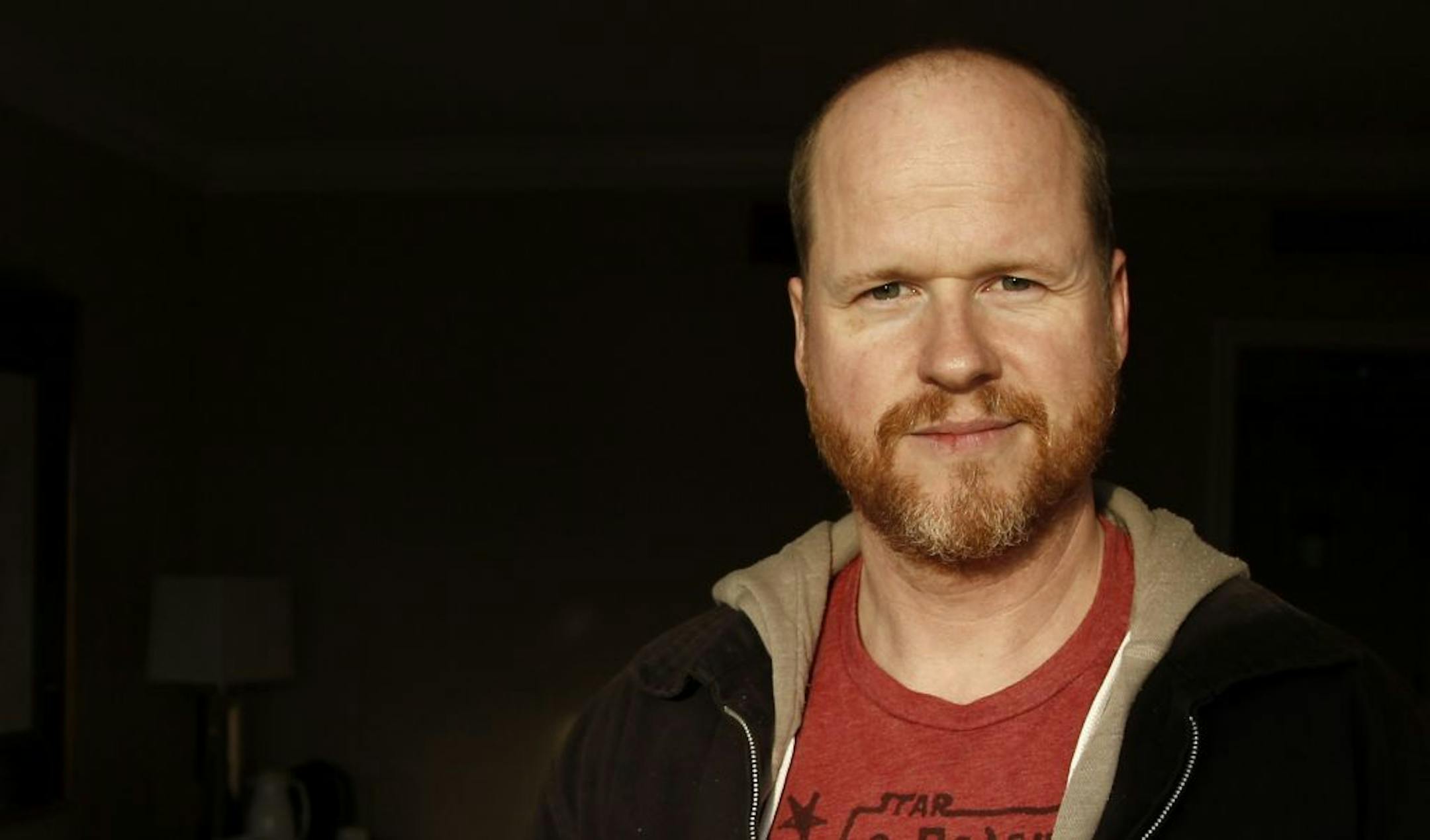 FILE - This May 4, 2012 file photo shows writer and director, Joss Whedon, from the film "The Avengers," posing for a portrait in Beverly Hills, Calif. Whedon said Sunday, July 21, 2013 at Comic-Con International that the storylines of Buffy and his other Vampire Slayer title Angel & Faith will intertwine in interesting ways when Season 10 begins its published run.