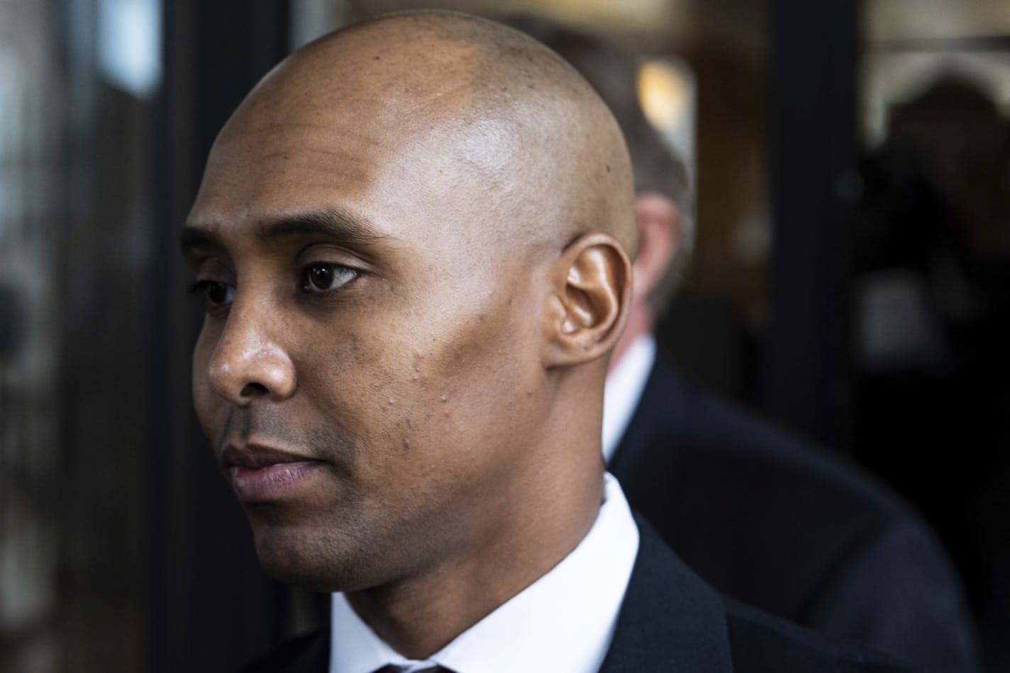 Former Minneapolis police officer Mohamed Noor leaves the Hennepin County Government Center after the first day of trial in Minneapolis on Monday, April 1, 2019. Noor is charged in the July 2017 death of Justine Ruszczyk Damond, who was killed after she called 911 to report a possible sexual assault behind her home. (Evan Frost/Minnesota Public Radio via AP)