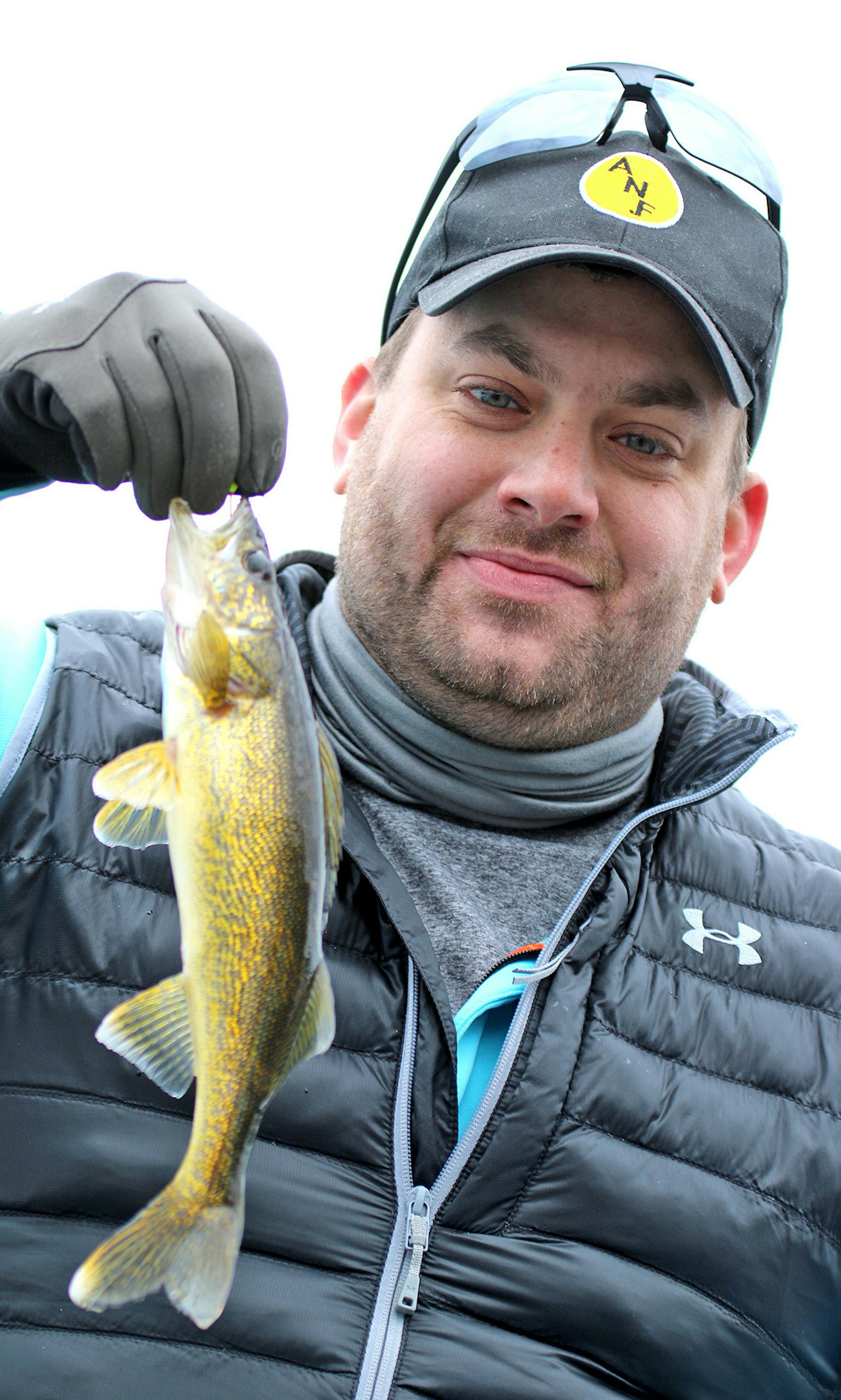 Chris Ward of South St. Paul shows off his first walleye of the day early Saturday on Lake Vermilion. Opening day of the fishing season drew large crowds to the lake and the walleyes were biting.