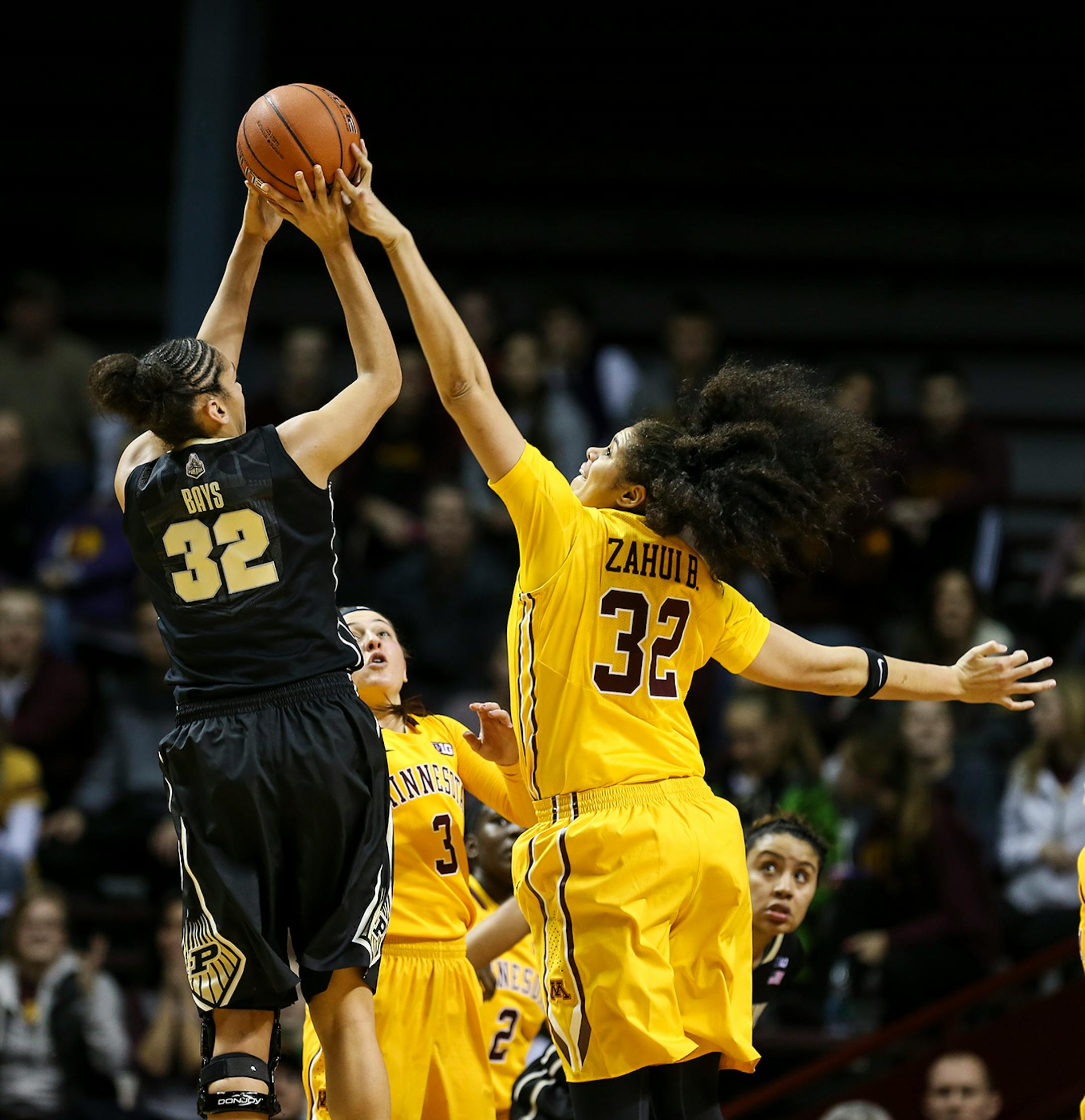 Gophers Amanda Zahui B. (32) tried to knock the ball from Purdue's Whitney Bays (32) during the second half. Amanda Zahui B. got a personal foul play. ] RENEE JONES SCHNEIDER • reneejones@startribune.com Minnesota Gophers women's basketball verse. Purdue Boilermakers at Williams Arena at the University of Minnesota on Thursday, January 22, 2015 in Minneapolis, Minn.