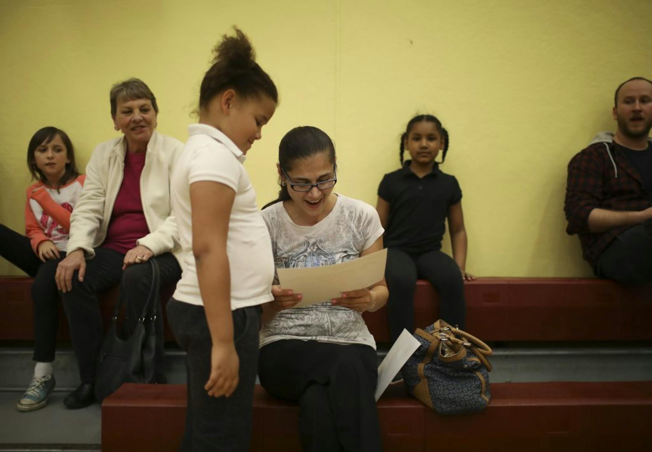 Denise Hayes, 8, and a second grader, proudly shared her attendance award with her mom, Denise Mlejnek.