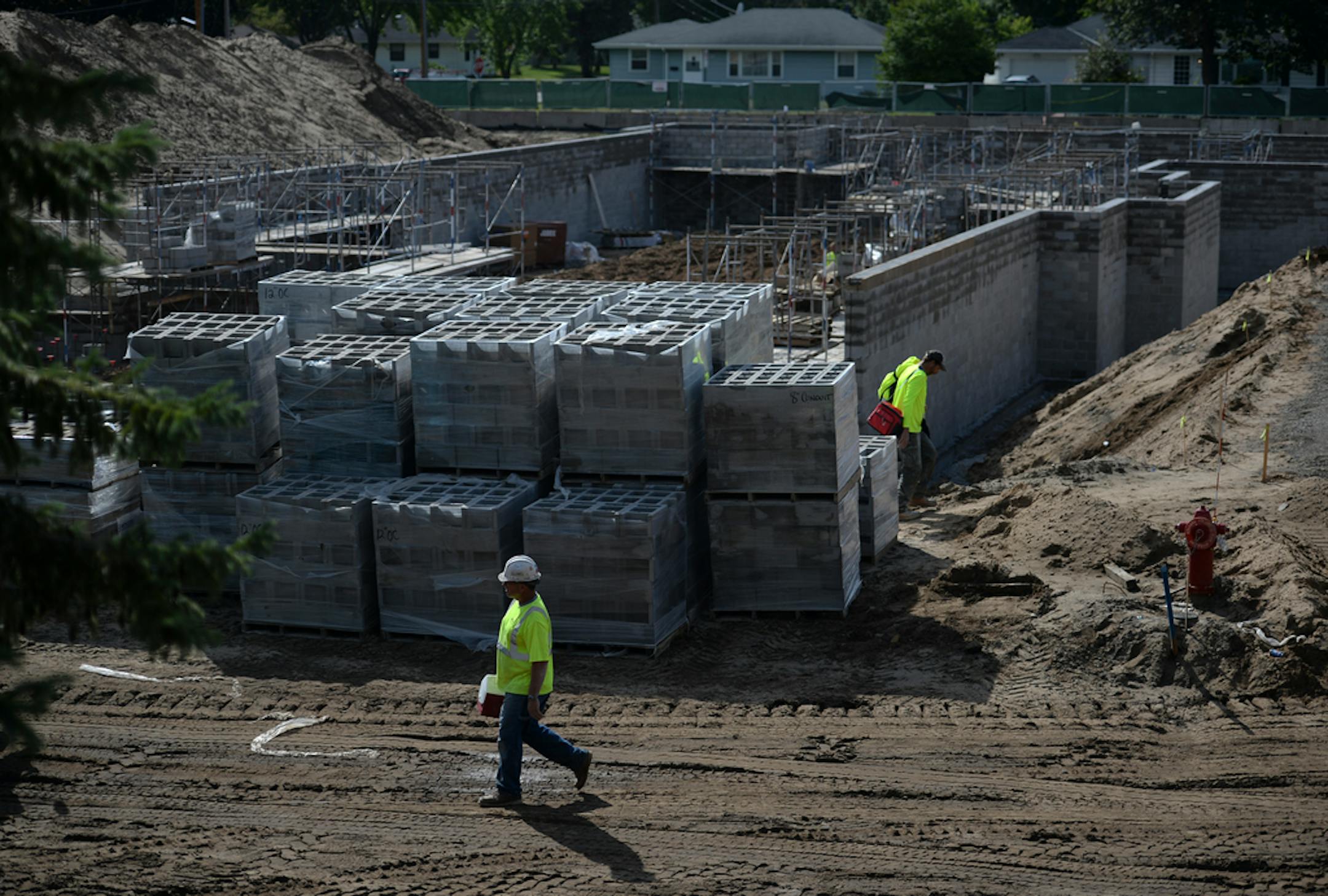 Workers at the under-construction Chamberlain housing development Wednesday. ] AARON LAVINSKY ¥ aaron.lavinsky@startribune.com Richfield currently has more than $200 million worth of redevelopment going on in the city, which amounts to more than a dozen projects already under construction and more coming their way, including a Jaguar and Land Rover dealership. What does the future hold for the city, which has no vacant space and one of the hottest real estate markets in the state? Two of the big