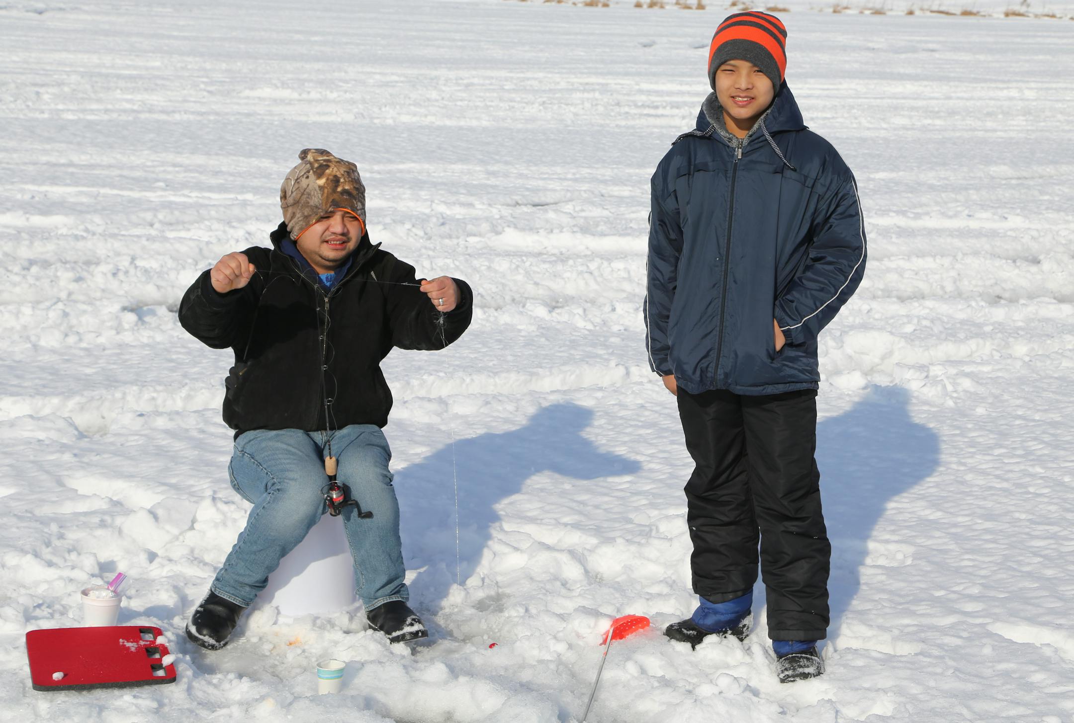 Thaw The Bwel Gyi, left, of St. Paul, and his nephew, Sahloa Moa Eh, 14, fished on Lake Owasso last weekend as part of an outdoors event Jan. 27 sponsored by the Karen Organization of Minnesota.