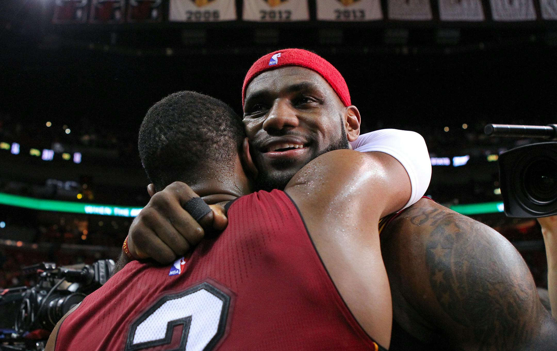 Miami Heat guard Dwyane Wade (3) hugs former teammate Cleveland Cavaliers forward LeBron James after an NBA basketball game at the AmericanAirlines Arena on Dec. 25, 2014 in Miami. It was LeBron James's first game back in Miami after leaving the Heat to go back to play with the Cavaliers. The Heat defeated the Cavaliers 101-91. (David Santiago/El Nuevo Herald/TNS)
