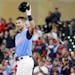 Minnesota Twins' Joe Mauer salutes the crowd after hitting a single against the Oakland Athletics in the fifth inning during a baseball game Friday, A