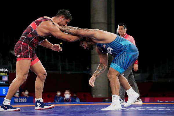 United State's Gable Dan Steveson compete with Turkey's Taha Akgul during the men's 125kg Freestyle wrestling quarterfinal match at the 2020 Summer Ol