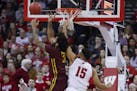 Minnesota's Jordan Murphy (3) goes after a defensive rebound against Wisconsin's Charles Thomas (15) during the first half of an NCAA college basketba