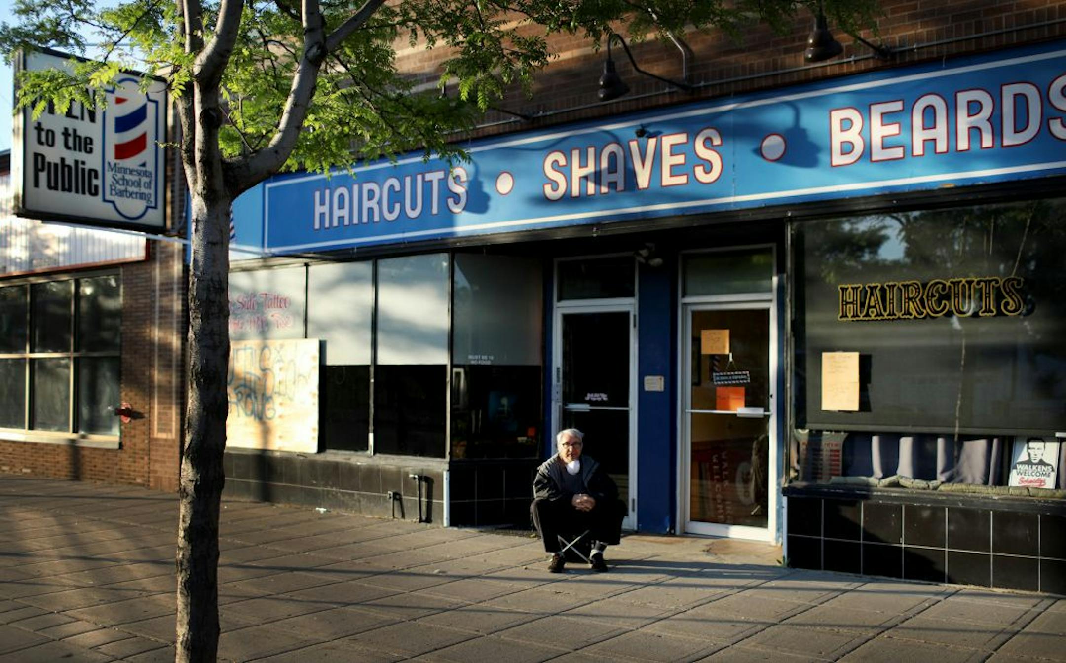 Jim, who wanted only his first name used, sat on a small stool waiting to get his hair cut outside Minnesota School of Barbering on Lake St. near S. 36th Ave. on Tuesday.