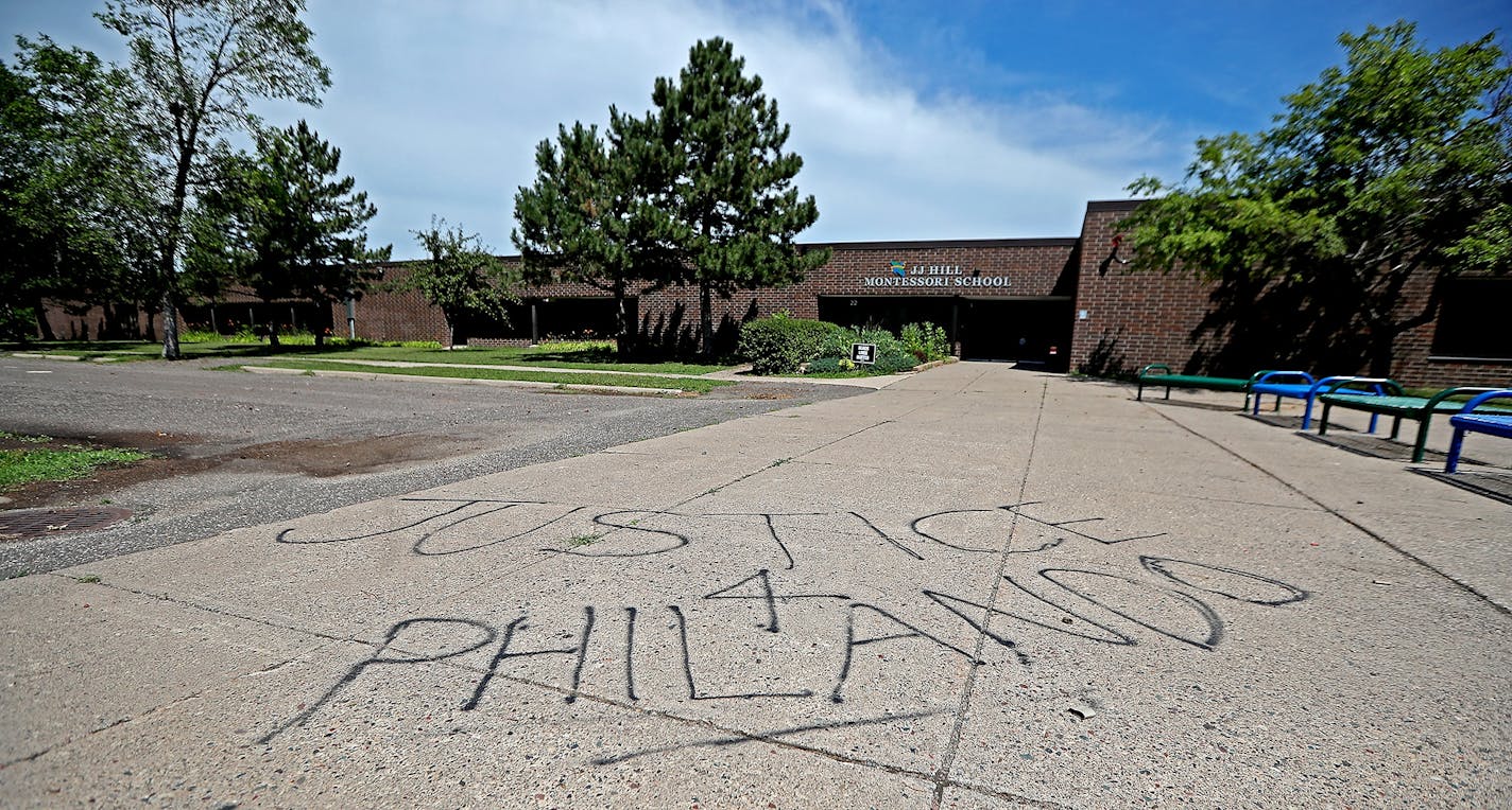 Graffiti outside J.J. Hill Montessori School, where Philando Castile worked. Castile, 32, a St. Paul schools employee, was shot by a police officer following a traffic stop in Falcon Heights, MN. Castile later died Wednesday night at HCMC.