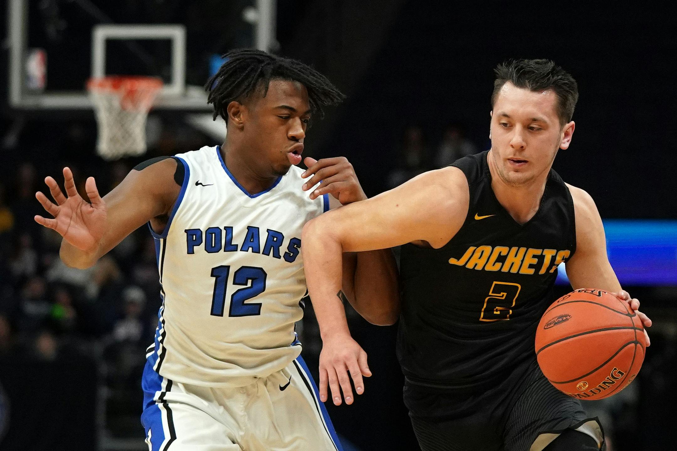Perham guard Jenson Beachy (2) took the ball down the court as Minneapolis North guard Nasir El-Amin (12) raced to defend in the first half. ] ANTHONY SOUFFLE • anthony.souffle@startribune.com Minneapolis North Community High School played Perham High School in an MSHSL Class 2A boys' semifinal basketball game Friday, March 22, 2019 at the Target Center in Minneapolis.