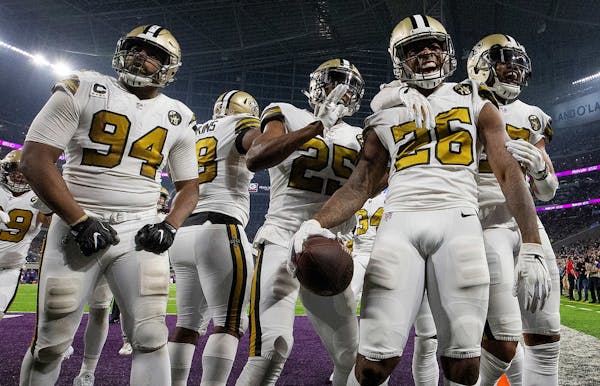 The New Orleans Saints defense celebrates a P.J. Williams (26) interception return of 45-yards for a touchdown in the third quarter