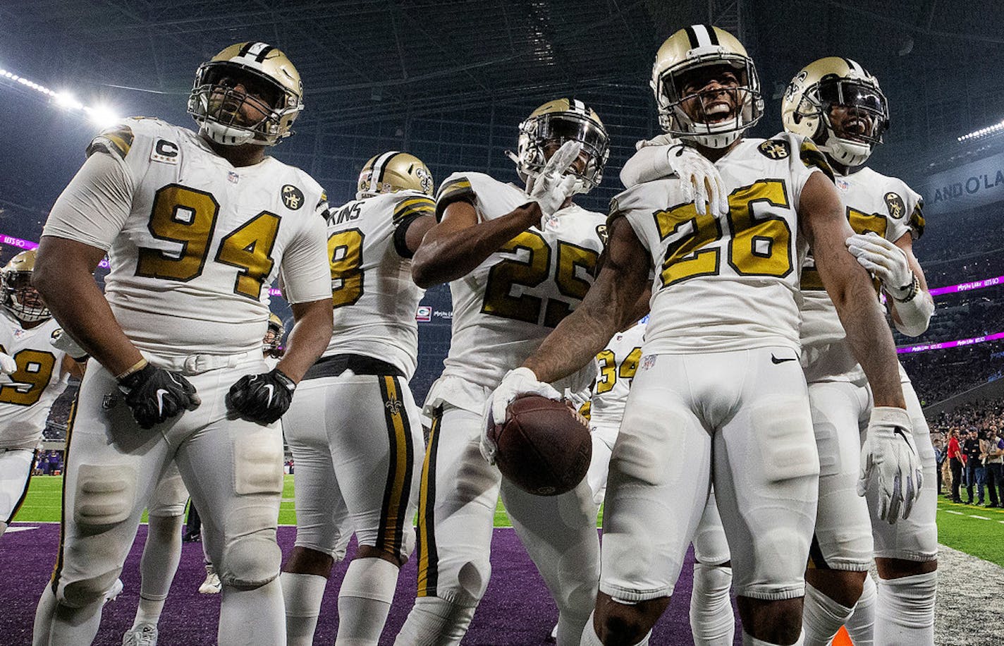 The New Orleans Saints defense celebrates a P.J. Williams (26) interception return of 45-yards for a touchdown in the third quarter