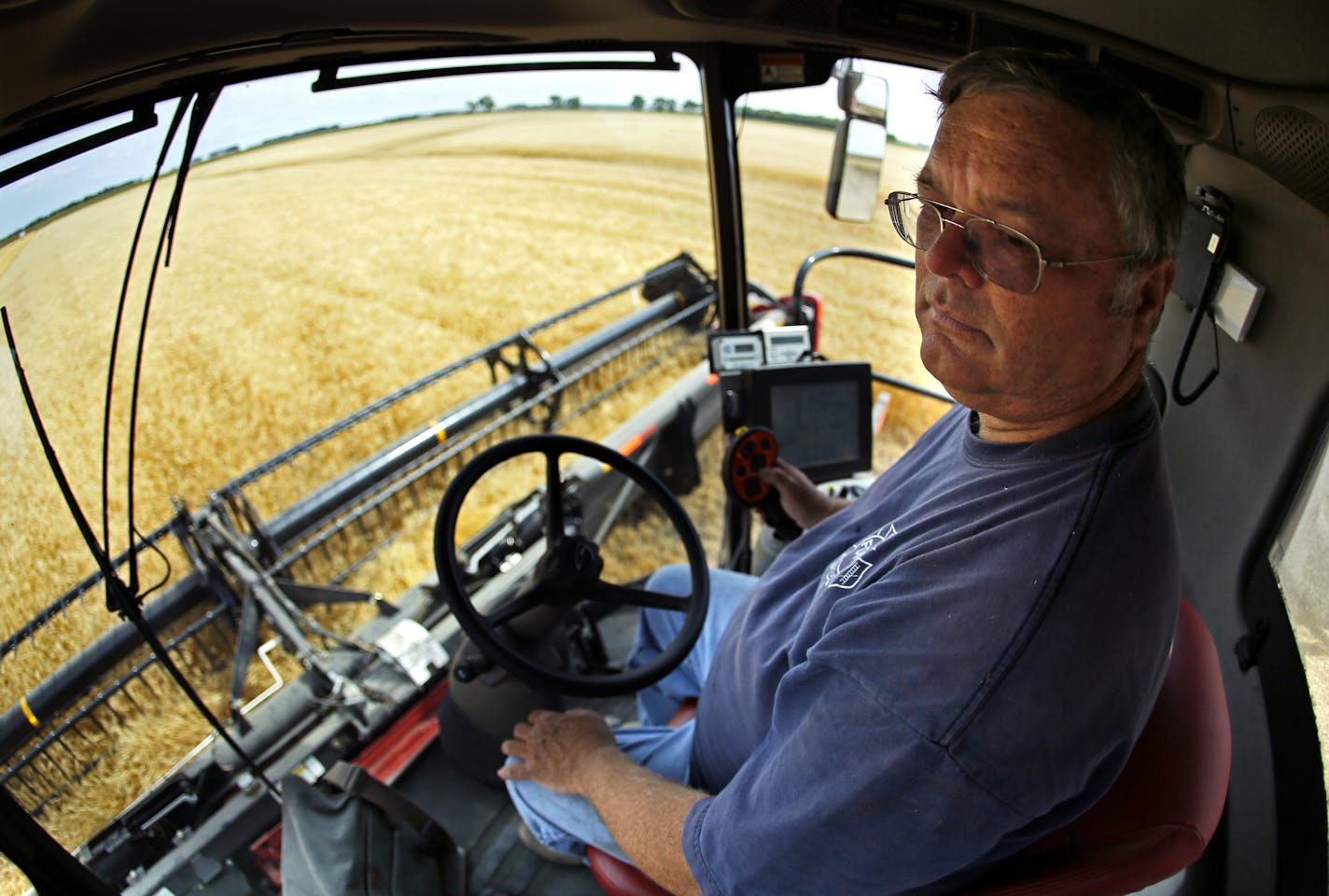 Jay Nord harvested wheat on his farm near Wolverton, Minn. Wheat and barley have made way for soybeans and corn on his farm.