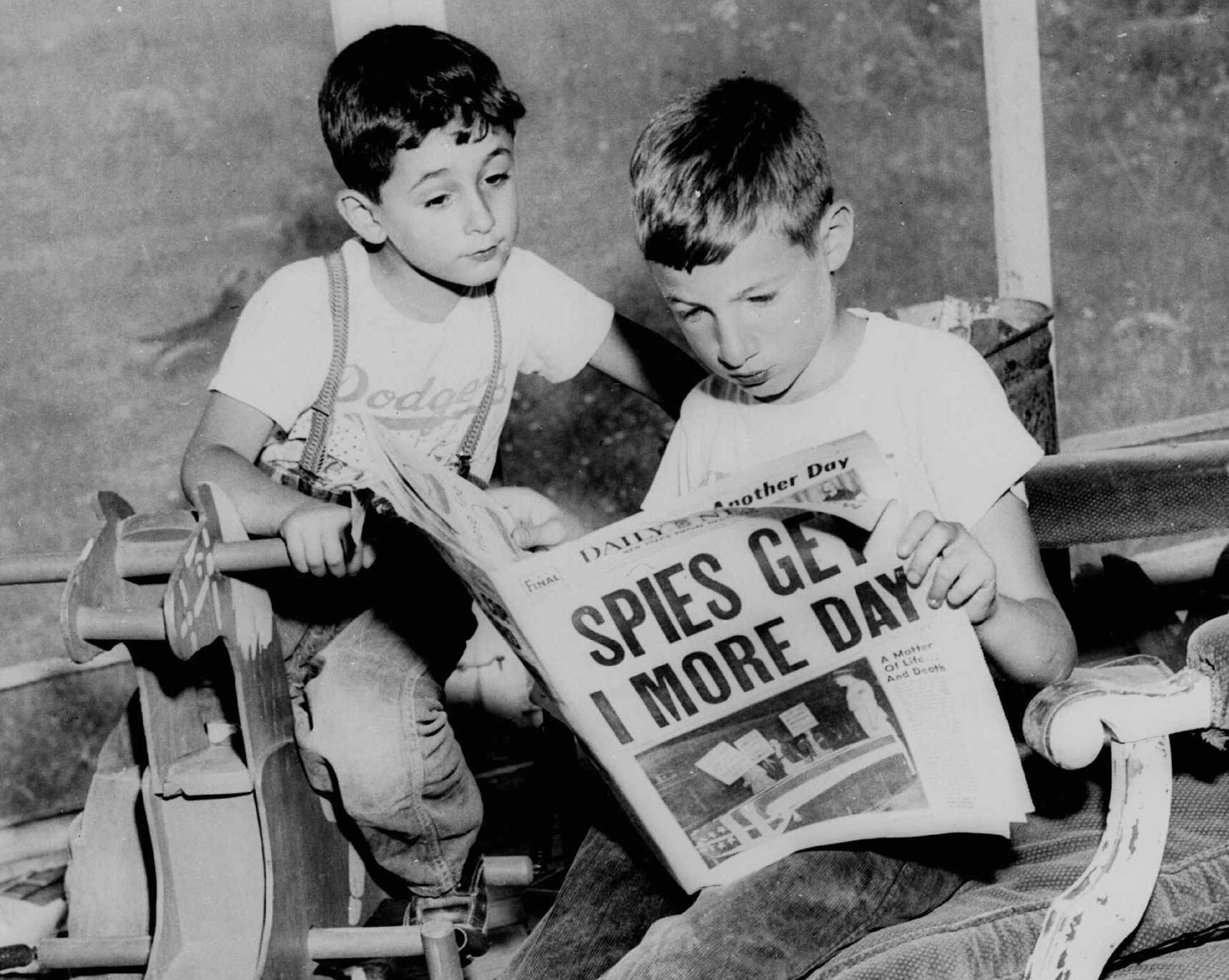 Michael Rosenberg, 10, right, and his brother, Robert, 6, sons of atom spies Julius and Ethel Rosenberg, read June 18, 1953 that their parents had one day more to live. The boys were at the home of friends in Toms River, N.J.