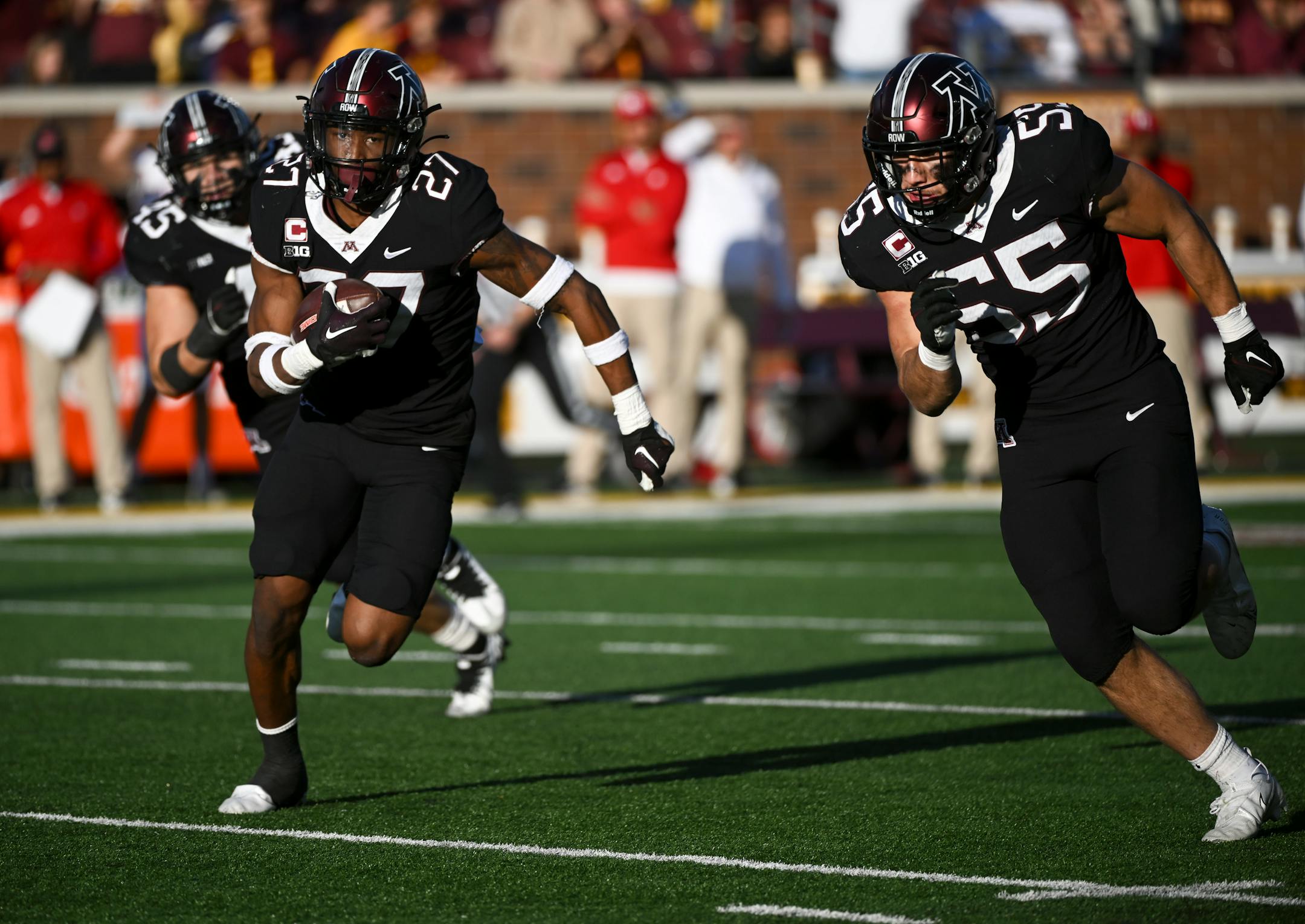 Minnesota Golden Gophers defensive back Tyler Nubin (27) runs the ball into the endone after intercepting a pass during the fourth quarter.
