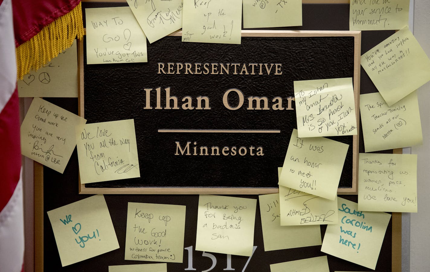 People leave post-it notes of support outside the office of Rep. Ilhan Omar, D-Minn., on Capitol Hill, Monday, Feb. 11, 2019, in Washington. Omar has "unequivocally" apologized for tweets suggesting a powerful pro-Israel interest group paid members of Congress to support Israel. Earlier Monday, House Speaker Nancy Pelosi and other Democrats had rebuked her for the tweets. (AP Photo/Andrew Harnik)