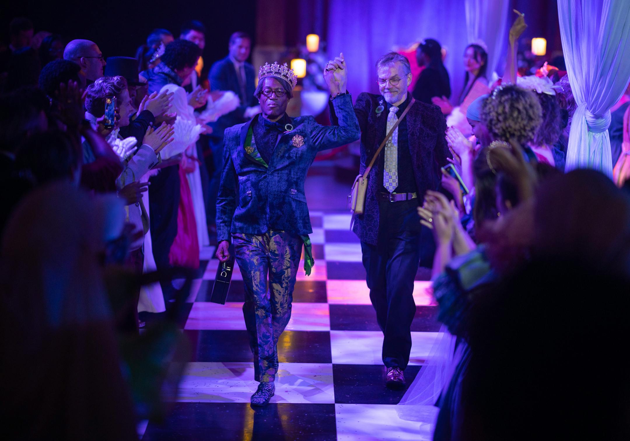 Two audience members danced along a gauntlet of other guests on opening night of The Queen's Ball: A Bridgerton Experience.