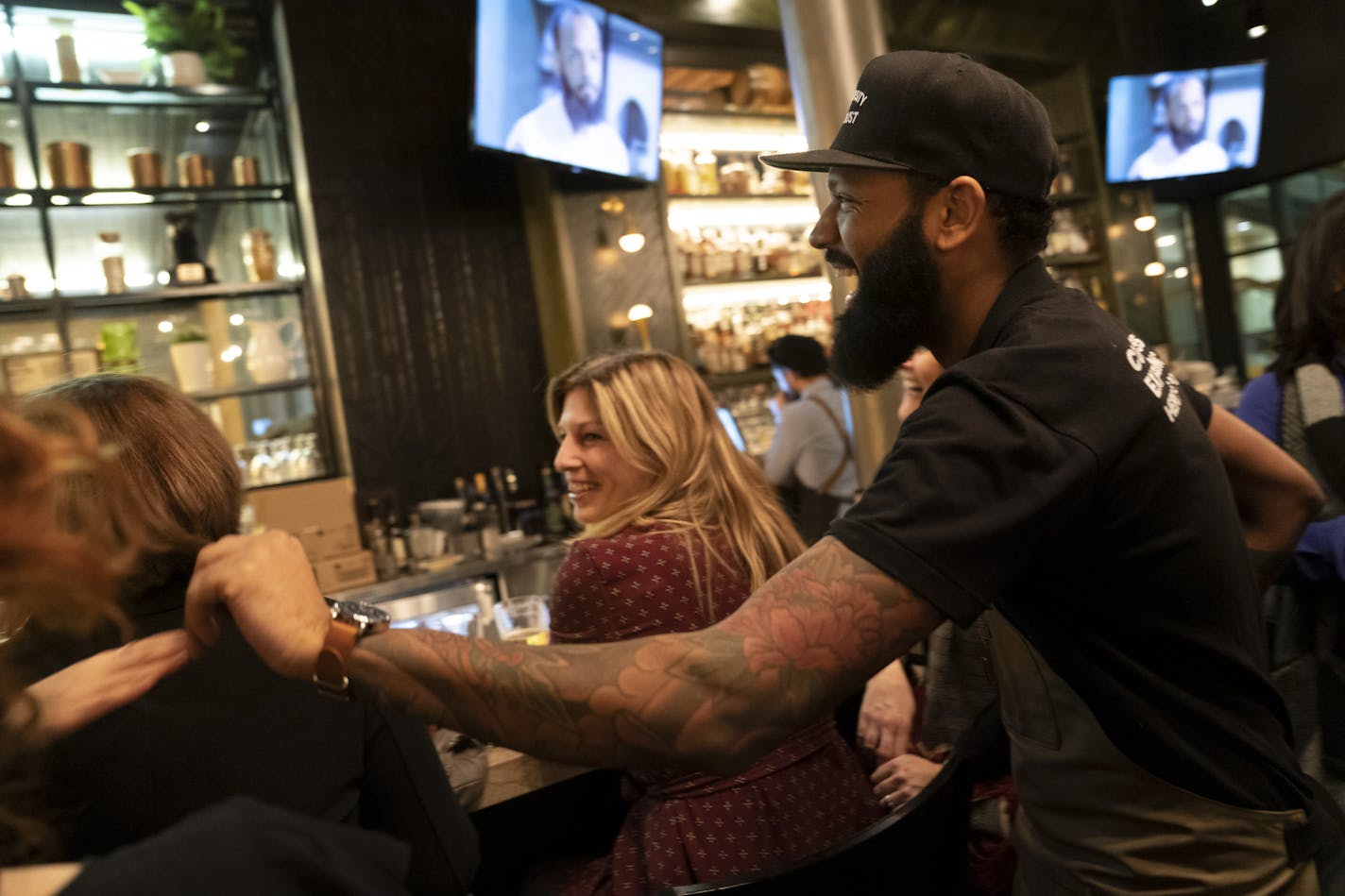 Chef and Top Chef contestant Justin Sutherland laughed with guests of his restaurant the Handsome Hog in St. Paul, Minn., as they watched Top Chef on the restaurant televisions on Thursday, January 17, 2019. ] RENEE JONES SCHNEIDER &#xa5; renee.jones@startribune.com The restaurant hosted a six course meal before a viewing party of Top Chef, a show that Sutherland is a contestant on.