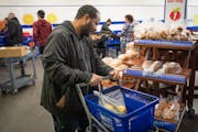 Torry Beasley chose carefully as he moved through the line at Open Cupboard food bank this past February.