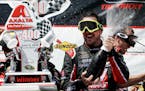 Kurt Busch celebrated with his team in Victory Lane after winning the NASCAR Sprint Cup series auto race at Pocono Raceway on Monday.